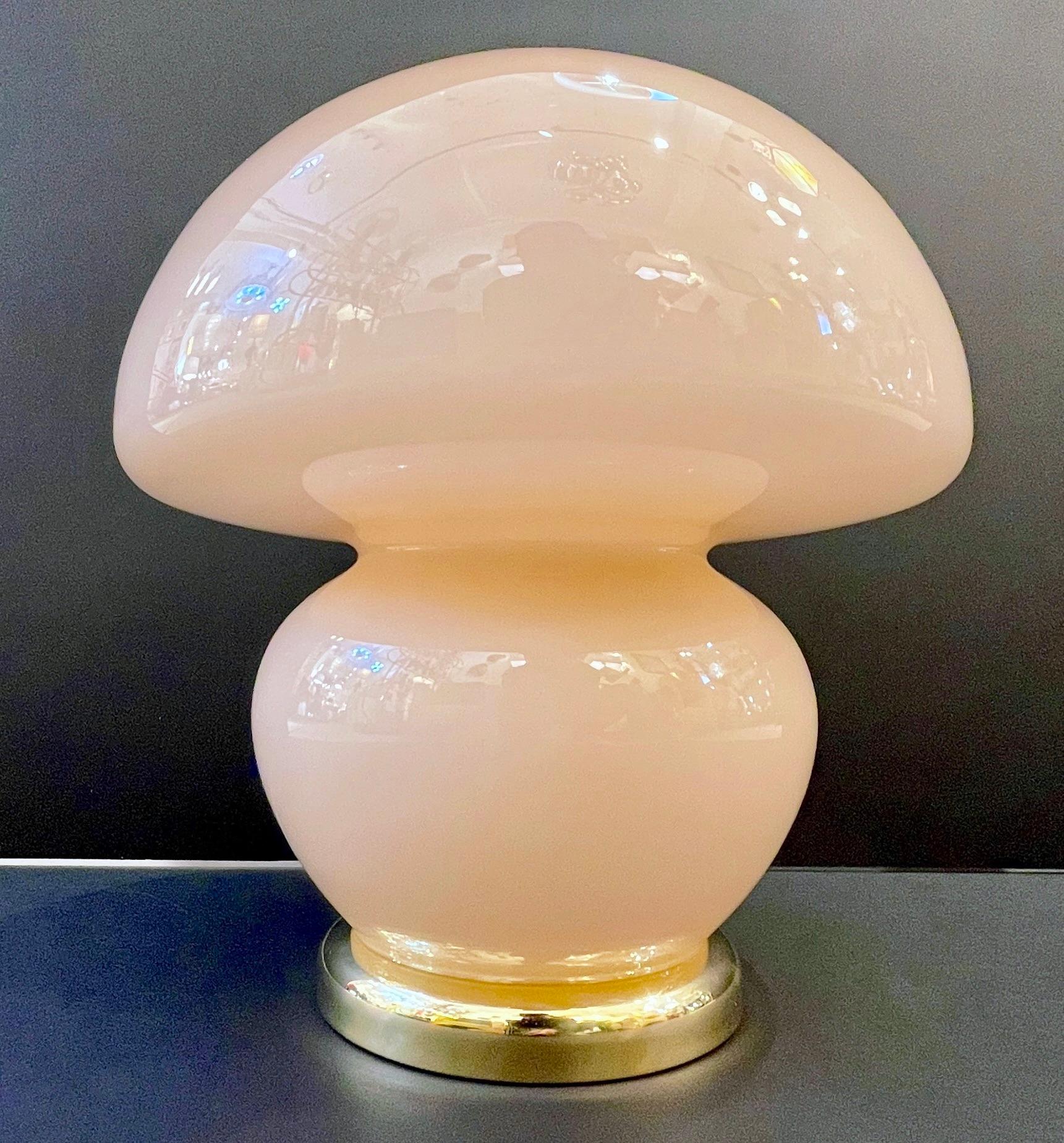 A pair of mid-20th Century Italian Design Murano glass table lamps, special for their enticing and rare color: the blown glass has a soft, pale shade of rose pink that allows to place these lights in any design style and with any colors as they act