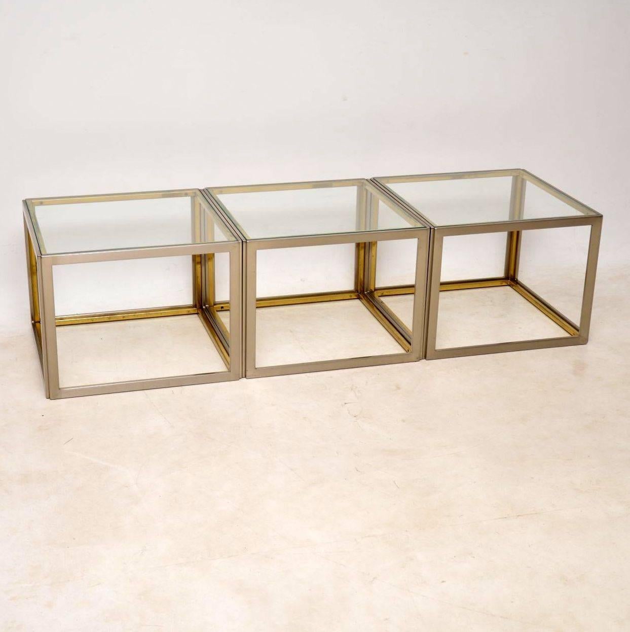 A very stylish and extremely well made set of vintage tables in brushed steel and brass, with clear glass tops. These were made in Italy and they date from around the 1970s. The quality is superb and the condition is excellent for their age, with