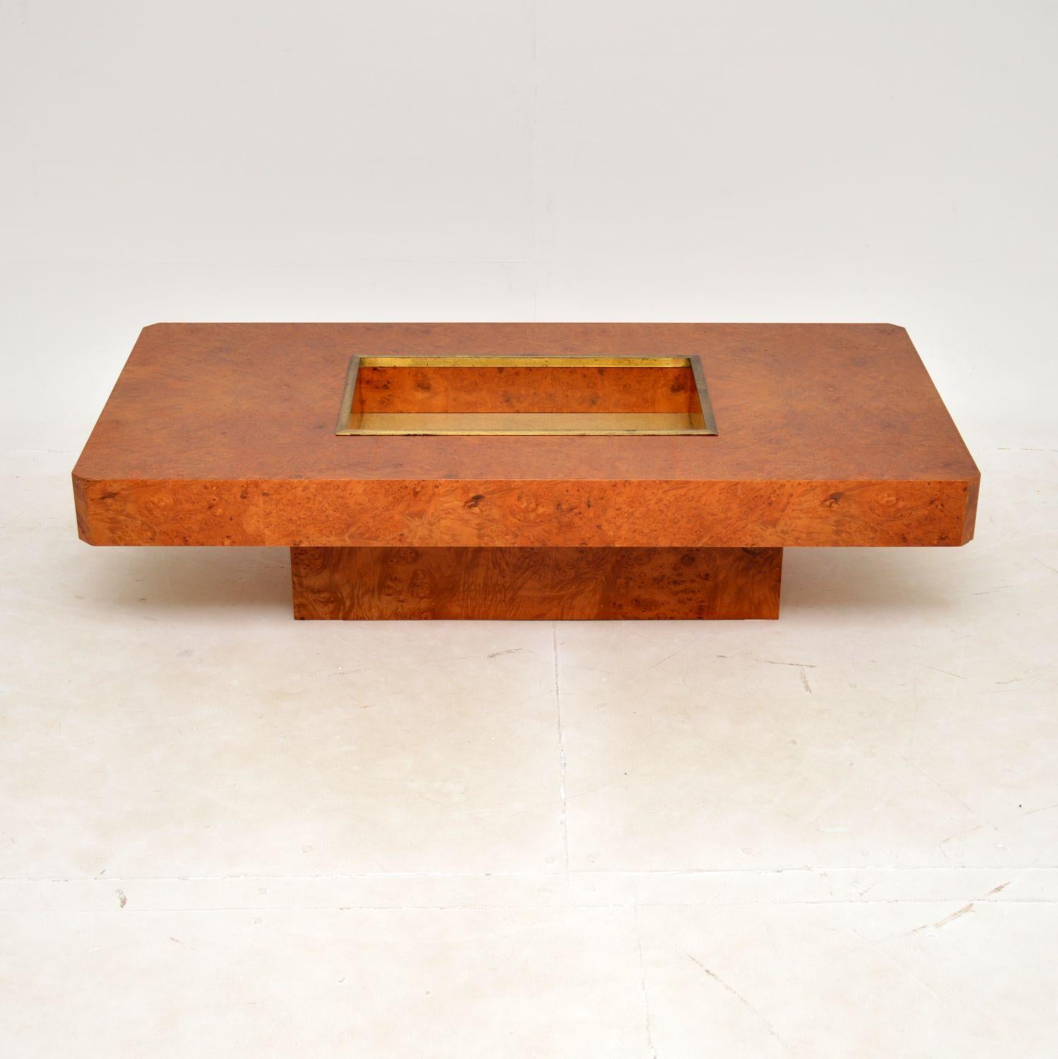 An extremely stylish vintage Italian coffee table in burr walnut and brass. This is in the manner of Willy Rizzo, it was made in Italy and it dates from the 1970’s.

The quality is superb, the top has a sunken dry bar which is brass lined. The