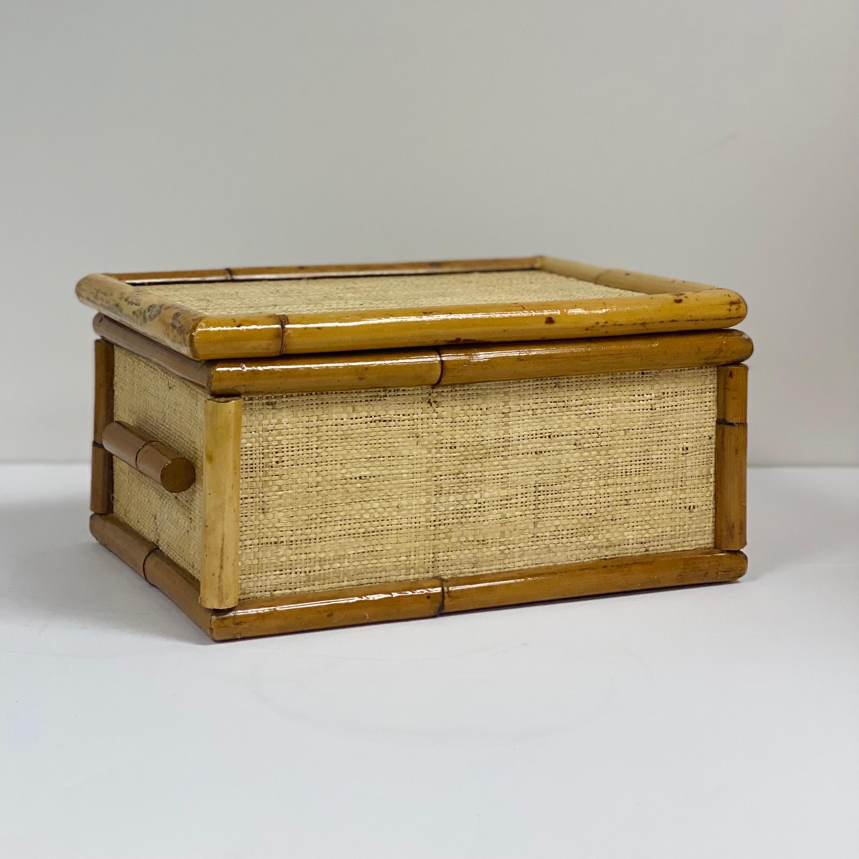 We are very pleased to offer a beautiful box, circa the 1970s. This handmade piece is woven from natural plant fibers for an organic look and feel. Taking on a rectangular silhouette, this box is wrapped in a neutral brown-hued jute grasscloth and