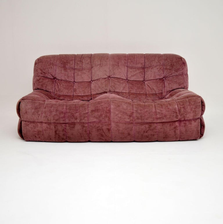 A stunning original vintage Kashima sofa, this was designed by Michel Ducaroy and made by Ligne Roset. It was made in France and dates from the 1970s-1980s. It is upholstered in a stunning violet colored fabric, and its extremely comfortable! We