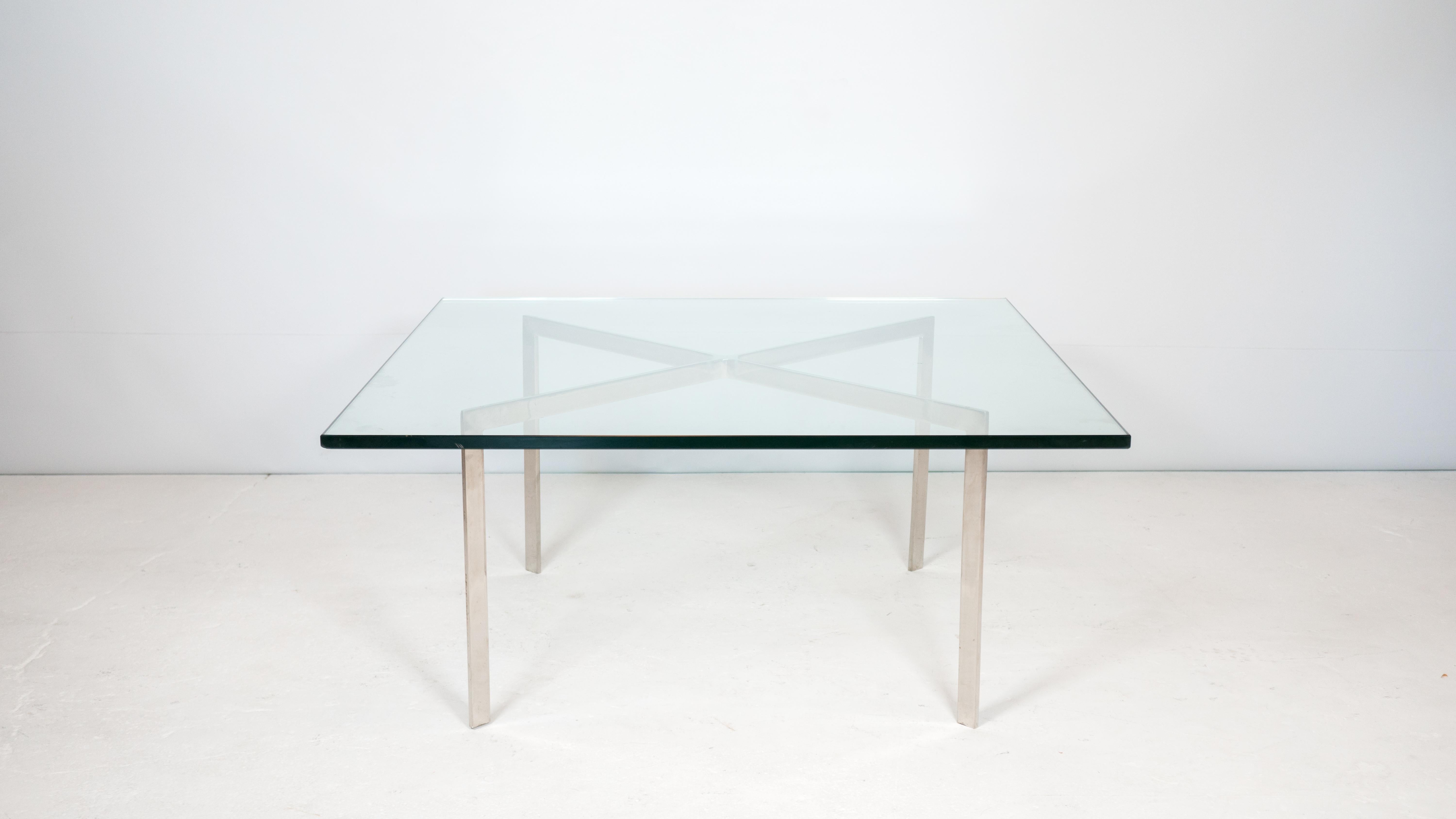 Vintage Knoll Barcelona Coffee Table, circa 1970s. Chrome frame with thick heavy glass top, epitomizes modern design and simple sophistication. No manufacturer marking. Good vintage condition, glass top has scratches and base shows some patina.