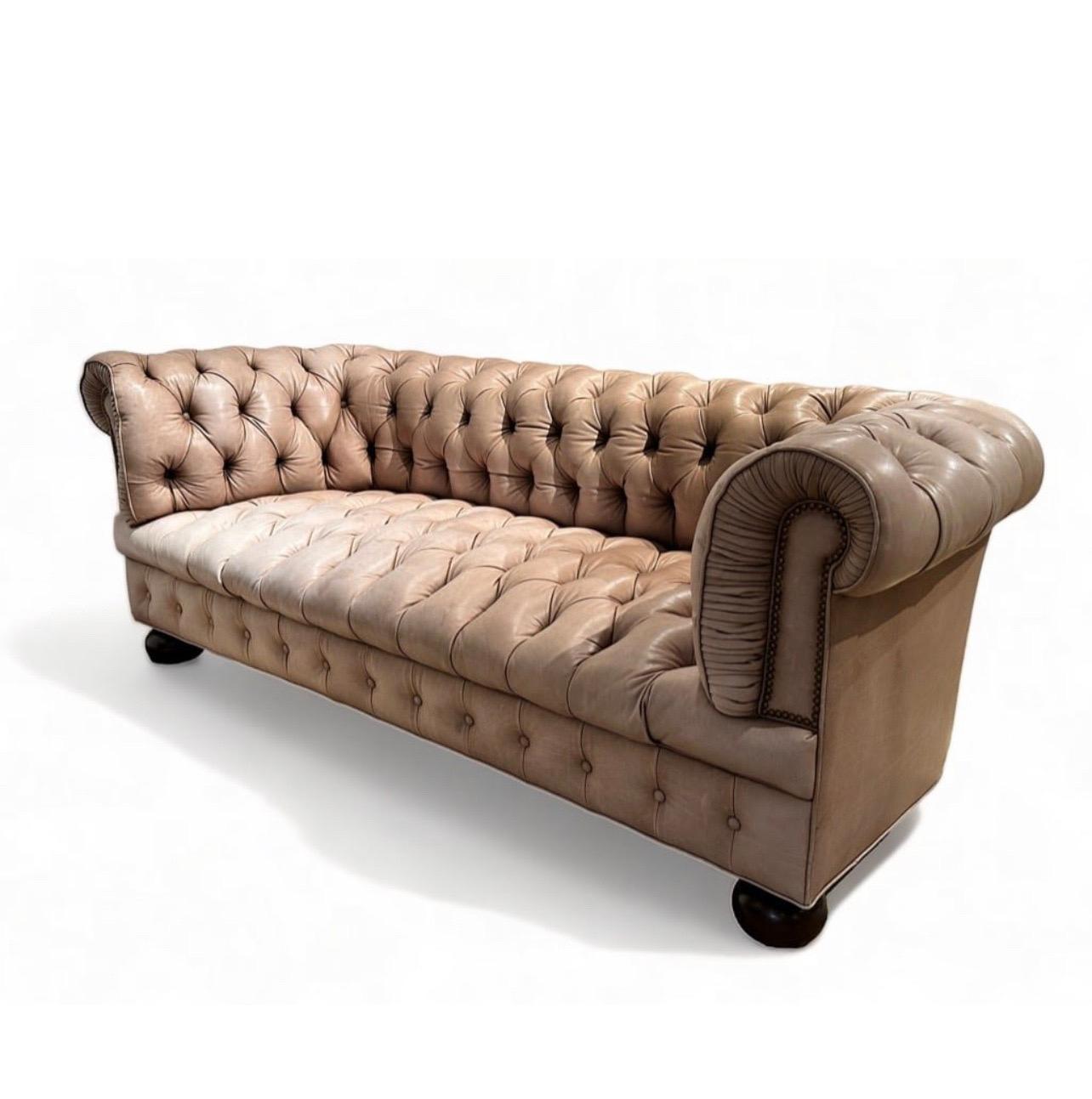 Beautiful Vintage Chesterfield Sofa from Stark, London
Rolled arms with tufted back and seat and raised on bun feet. Some subtle uneven sun fading adds an authentic vintage chesterfield charm to this beauty. Unmarked. Taupe Leather is butter soft