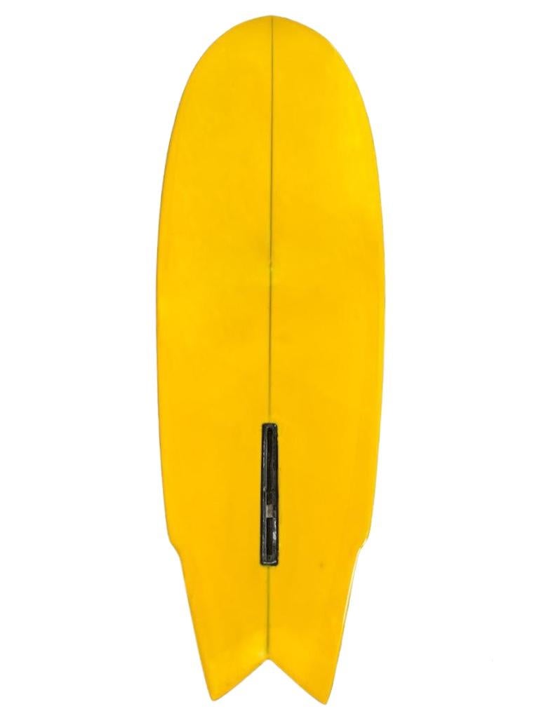 Late-1970s Lightning Bolt Gerry Lopez model surfboard made by Mickey Muñoz. Features golden yellow tint with blue bolt and red outline. The coveted Gerry “Mr. Pipeline” Lopez signature pro model. Wing swallow tail shape design. A beautiful example
