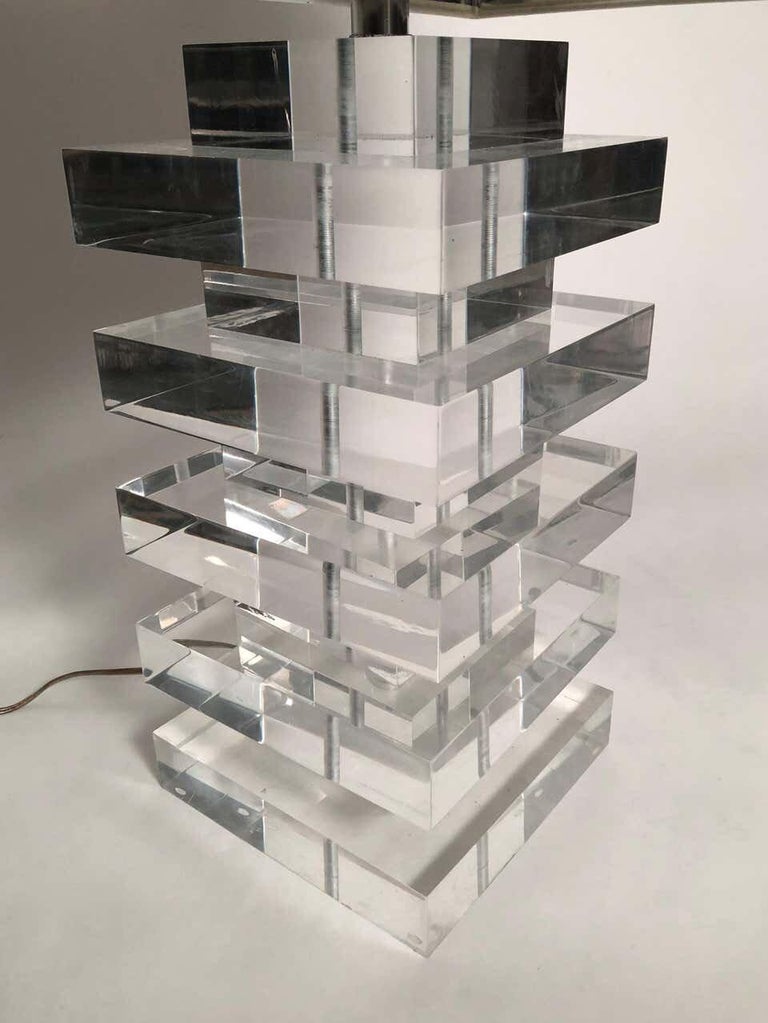 A very well made Lucite lamp, in the manner of Charles Hollis Jones, signed Marlee, circa 1970s, with thick, solid, stacked squares of alternating sizes on a square base. Original rectangular Lucite finial included. Includes optional rectangular