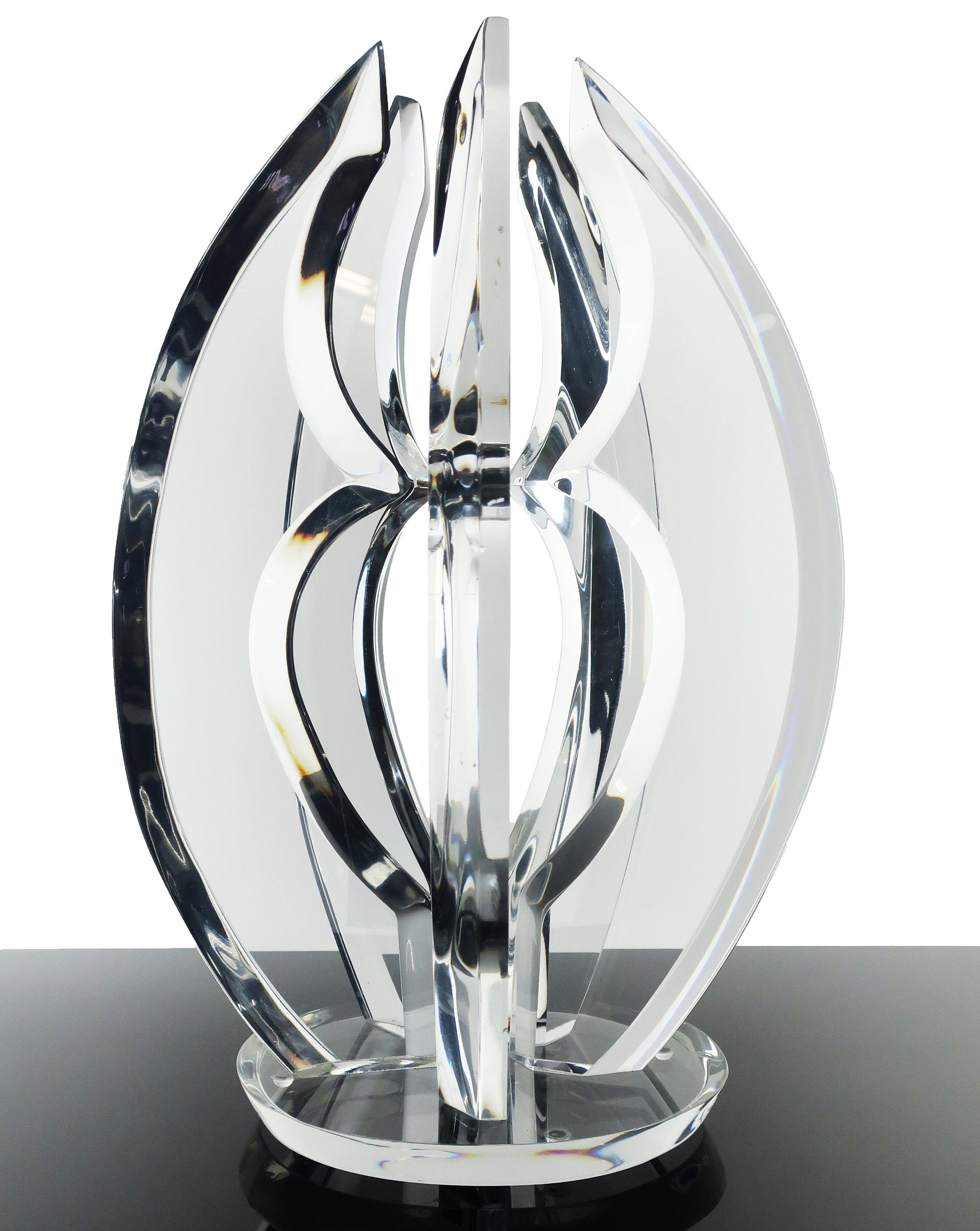 A fantastic curved Lucite sculpture in the style of Hivo Van Teal and Shlomi Haziza. Five identical beveled pieces mounted on a round base refract light and reflect colors to create an ever-changing object of art that is stunning as a shelf piece,