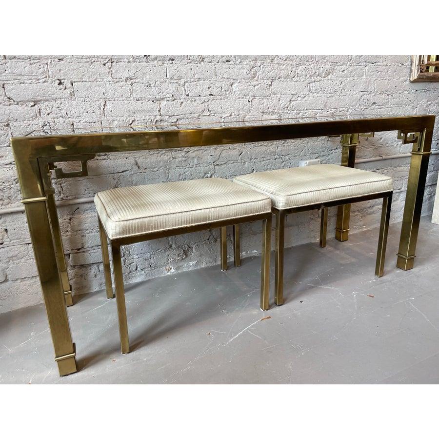 What can I say? I personally have one of these console tables in my living room (used as a sofa table) but I have never had one with the matching ottomans until now! The brass on all of the pieces is in excellent vintage condition. Original fabric