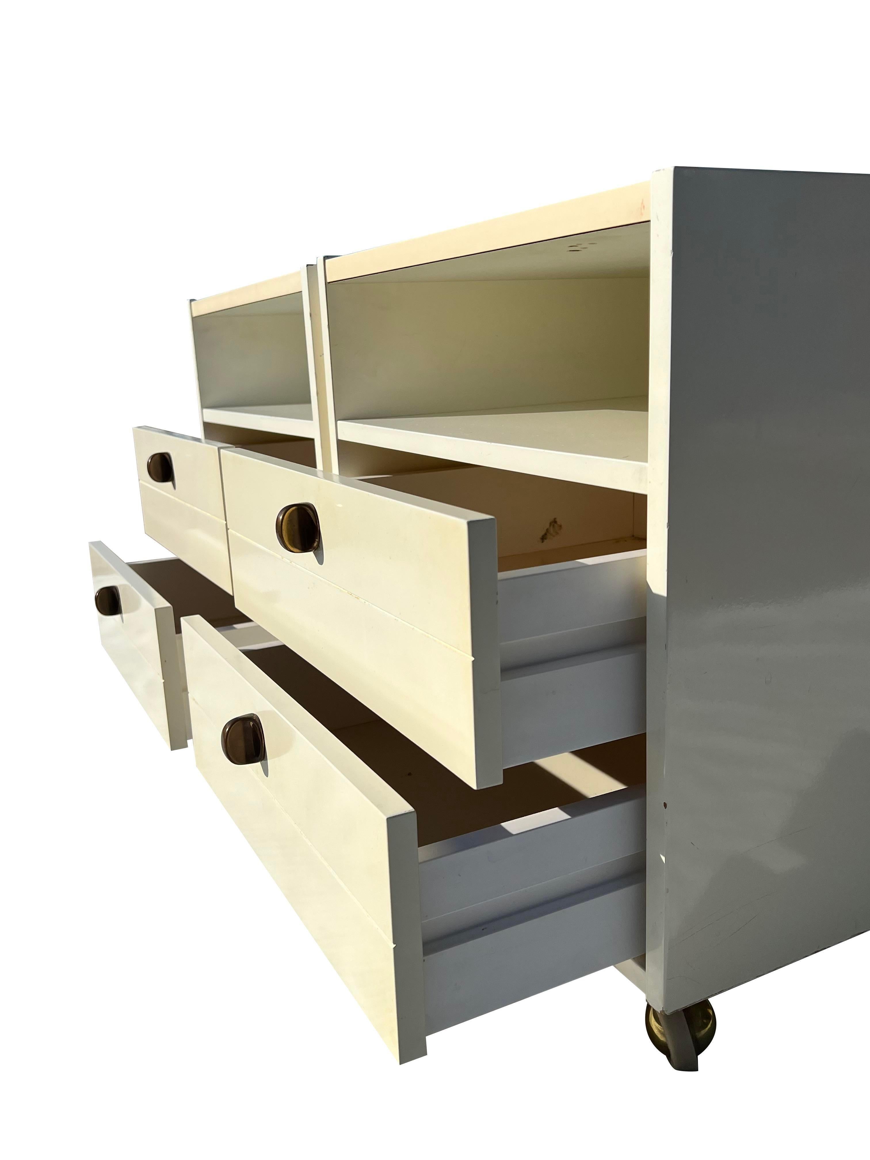 1970s Vintage Modern White Nightstands With Brass Hardware on Wheels - a Pair In Good Condition For Sale In Saddle River, NJ