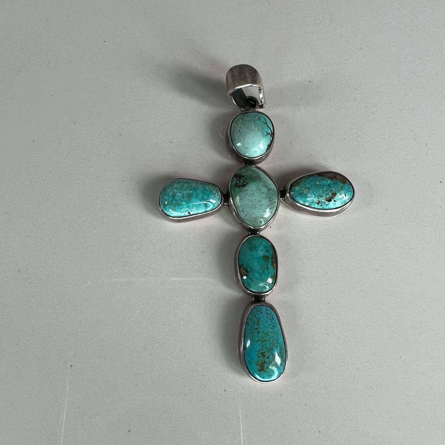 Vintage Navajo Southwestern sterling silver Turquoise cross pendant
Stamped sterling
Measures: 3.5 tall x 2 width x .19 thick
Preowned unrestored original vintage condition.
See images provided.
  