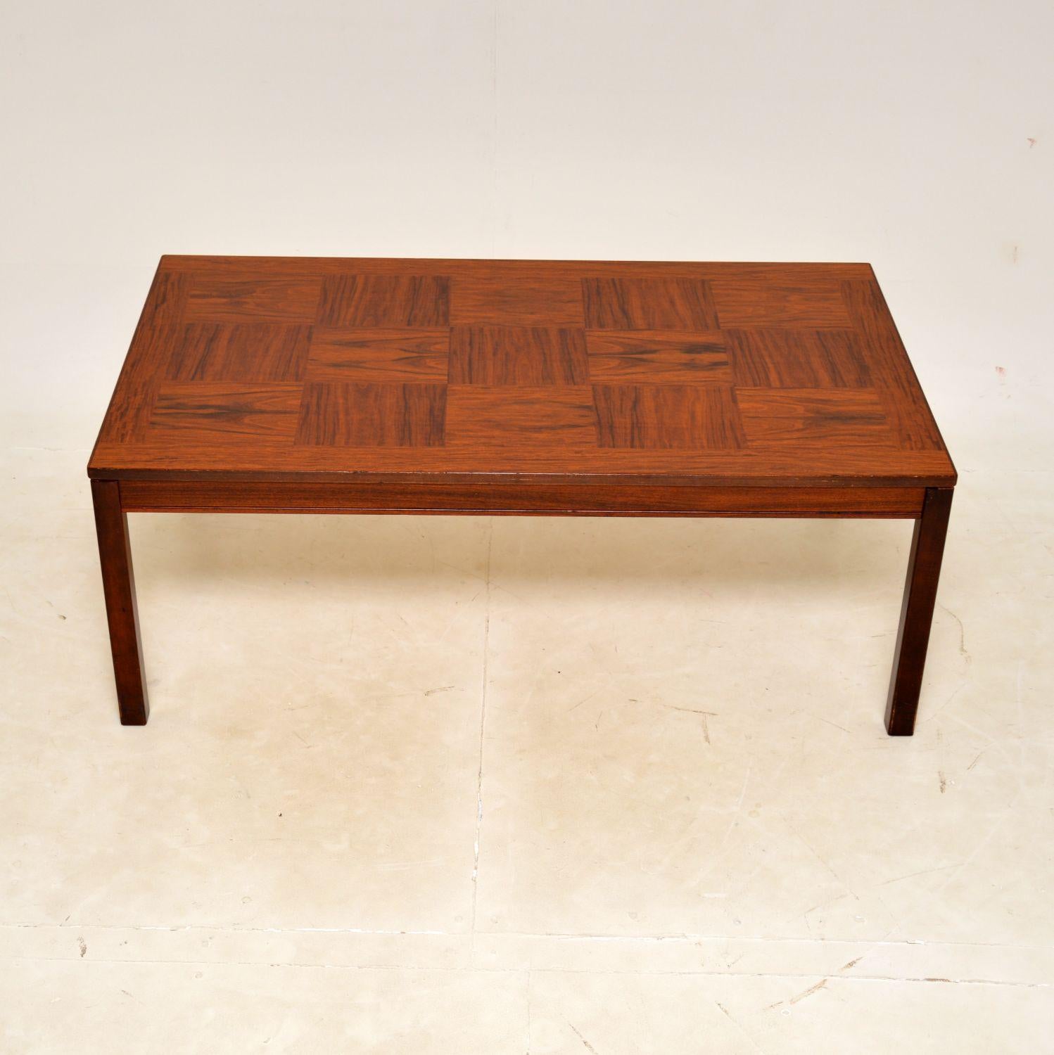 A large and impressive vintage coffee table. This was made in Norway by Heggen, it dates from the 1970s.

It is of superb quality, with a gorgeous parquetry design. The wood has a lovely colour and beautiful grain patterns. The legs can unbolt and