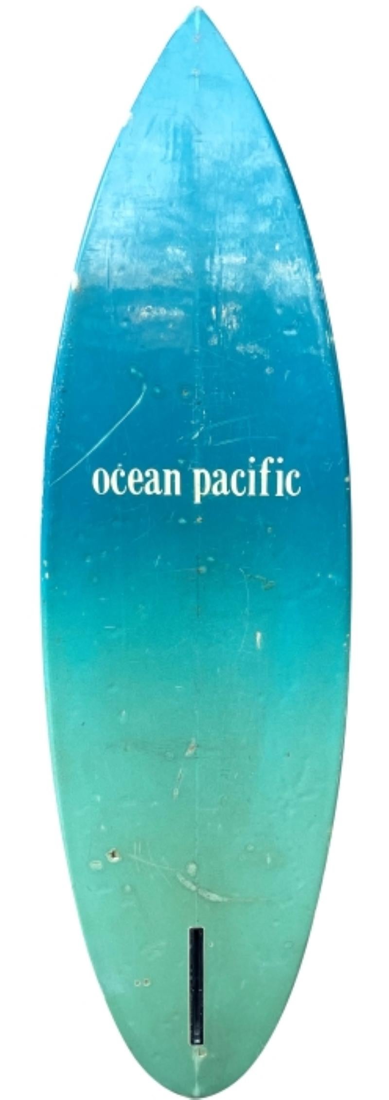 Late-1970's Ocean Pacific (Op) single-fin surfboard. Features stunning wave mural airbrush artwork done by the late Jack Meyer (1954-2007). A remarkable original surfboard work of art by a renowned surfboard artist of the 1970s-80s. 

Ocean