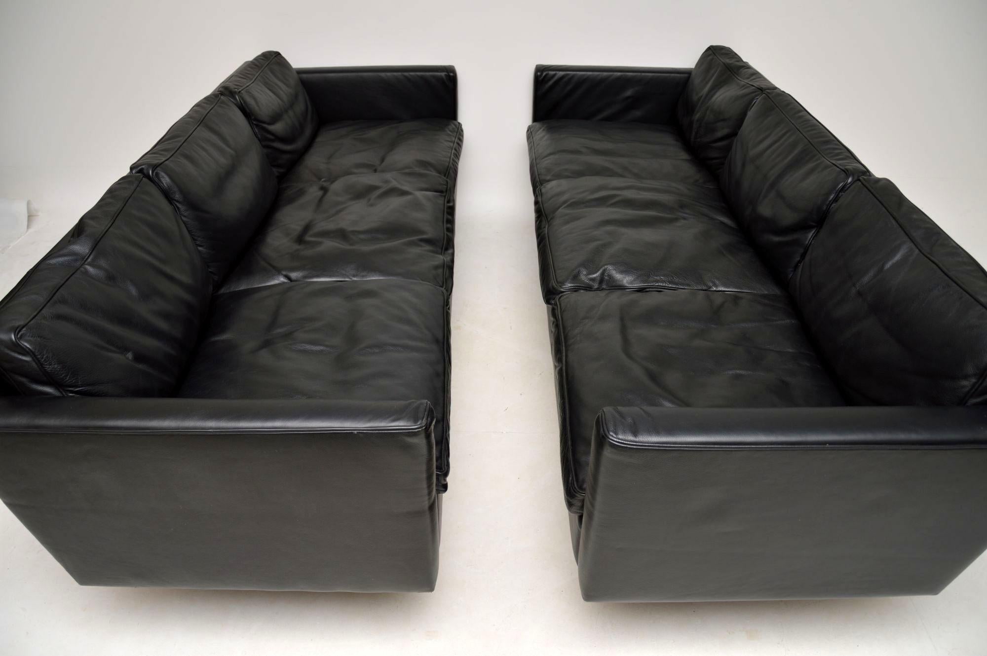 A very stylish, extremely well made and very comfortable pair of vintage black leather sofas, these were made in Denmark, circa 1970-1980s. They are in excellent condition, with only some very minor surface wear, they have no rips or tears. The