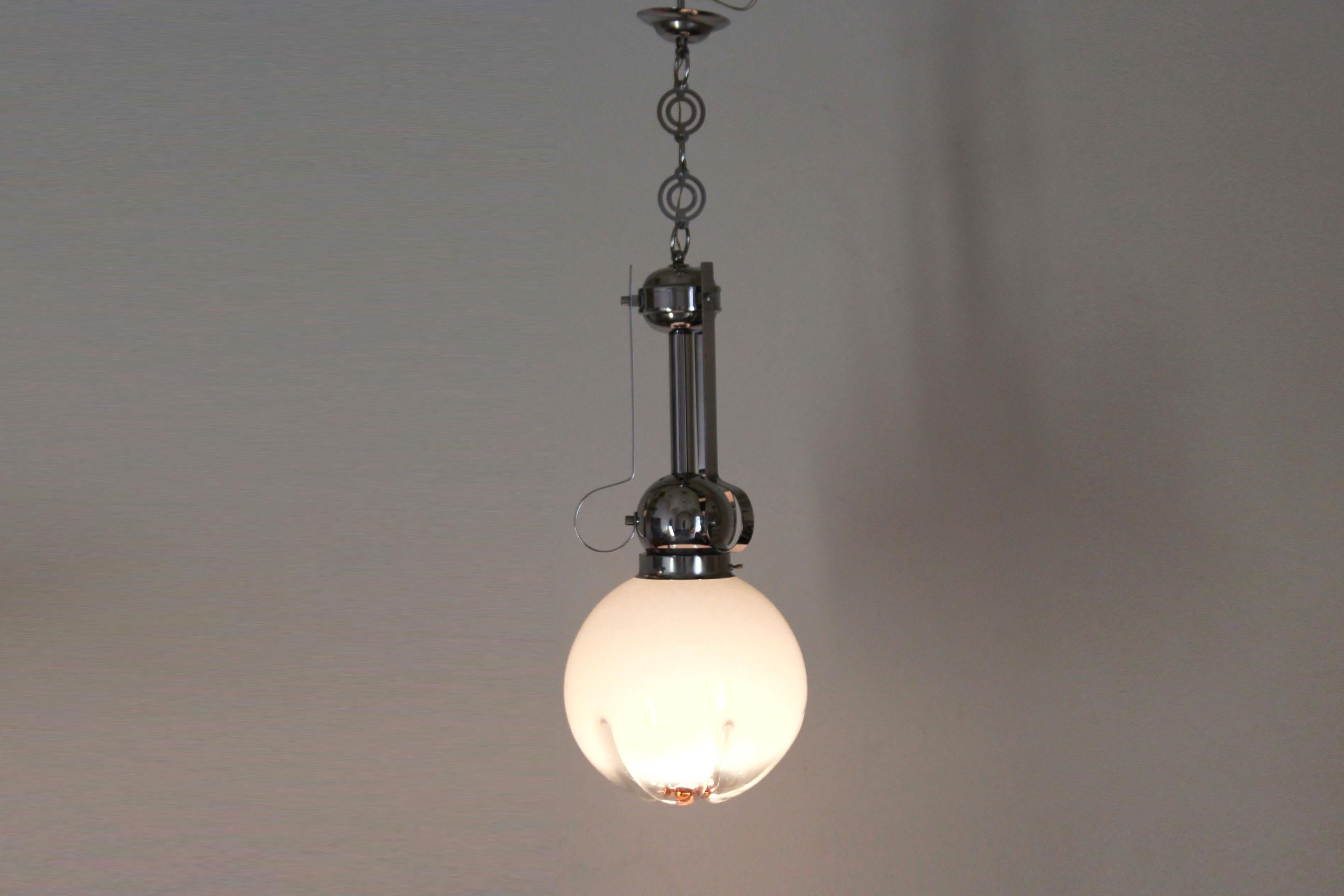 Vintage Murano Pendant, Mazzega Italy 1970s
A 1970s vintage pendant designed by Mazzega ltd. Murano glass light globe and chromed structure. In really good conditons with only few signs of time.

E27 light.