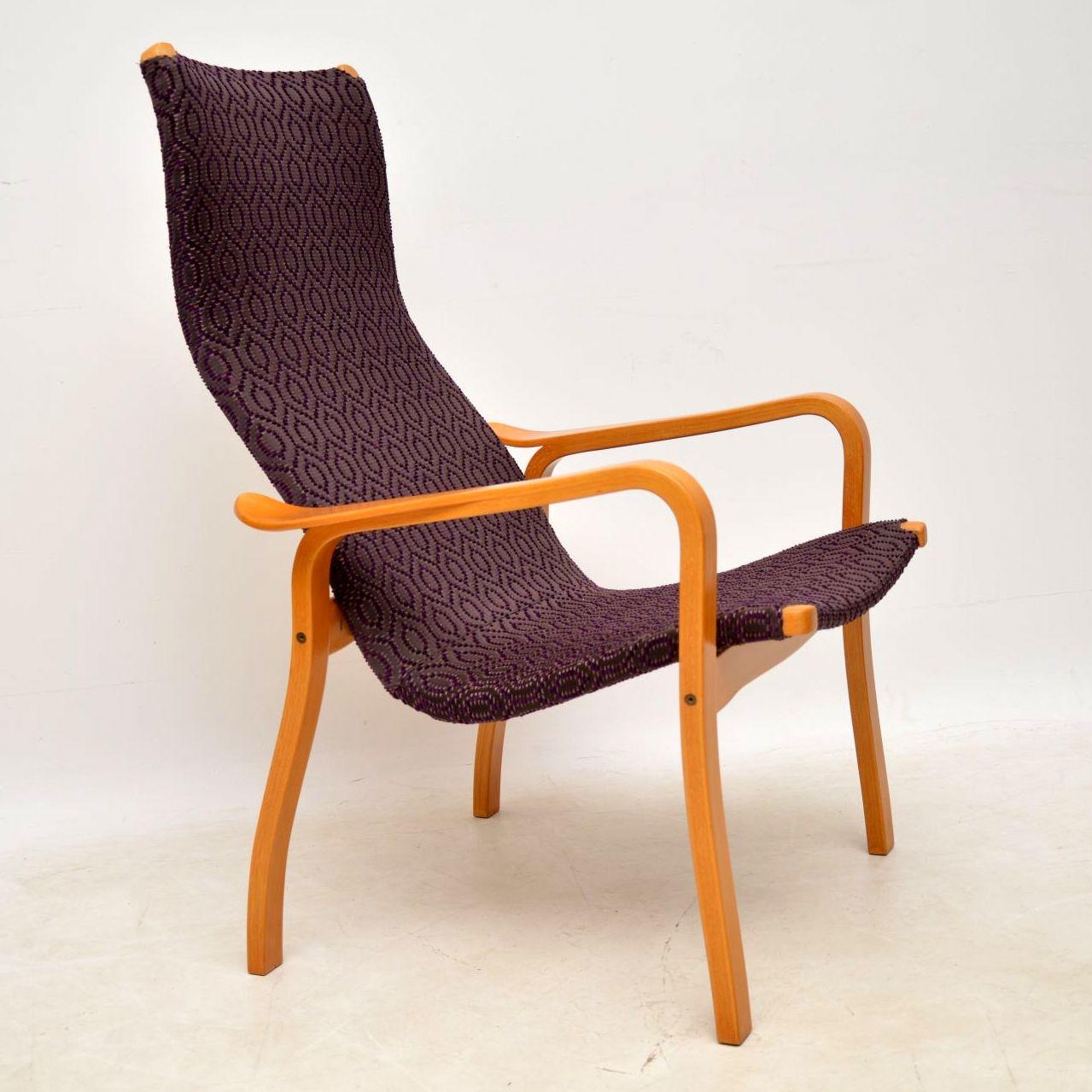 A stylish and extremely comfortable vintage armchair, made in Sweden by Swedese, this was designed by Yngve Ekstrom. The condition is superb for its age, the frame has just been fully stripped and re-polished to a very high standard, and it was