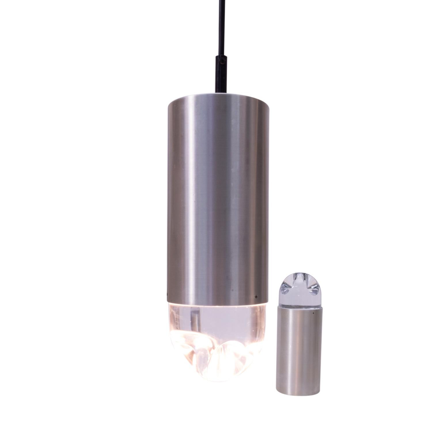 RAAK B-1105, B1106 “light shower” ceiling lamps or pendants in lightly brushed aluminum, with solid crystal top. No light source directly visible. Wiring replaced.

These lamps are a typical example of 1970s Dutch lighting, which widely used
