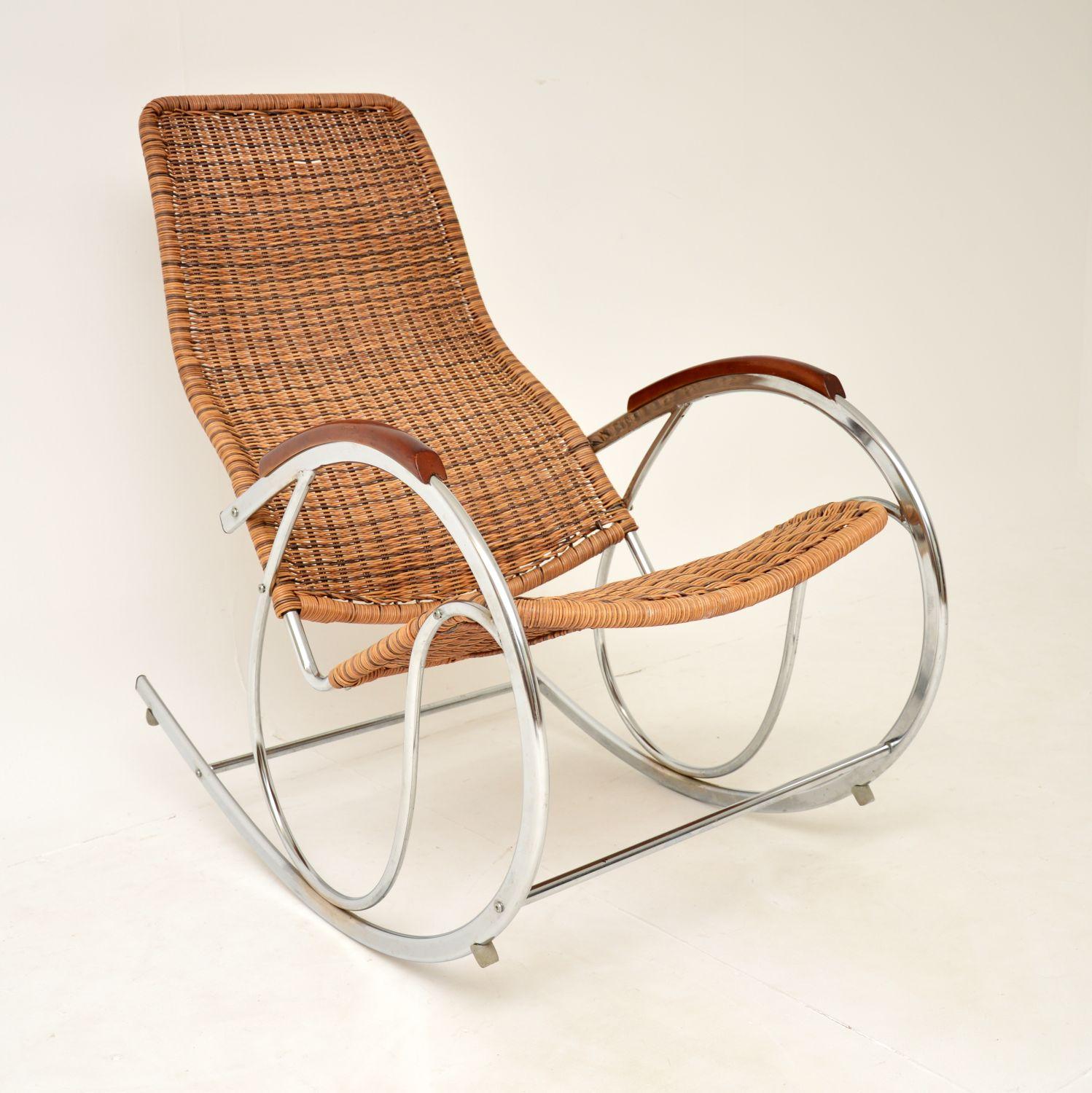 A fabulous vintage rocking chair with a chromed steel frame and woven rattan seat. This was made in England, it dates from around the 1970’s.

It is of superb quality and is extremely comfortable. The arms are solid wood, and the rattan is