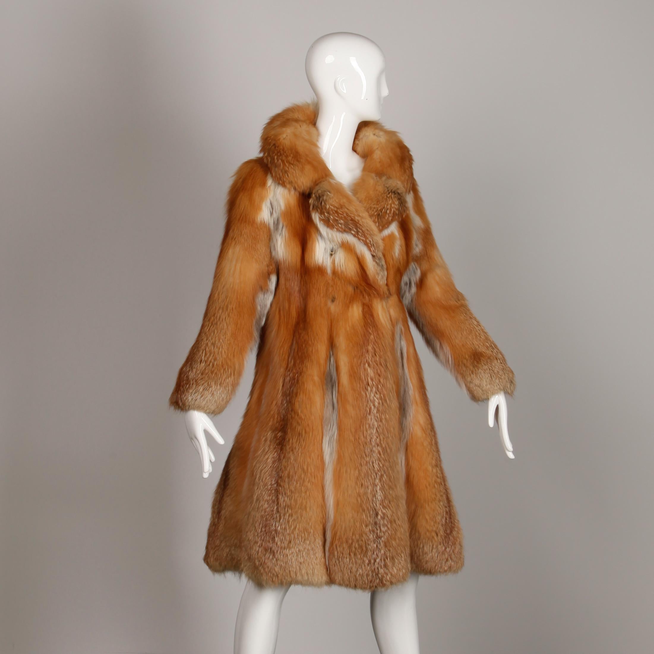 Stunning vintage 1970s red fox fur coat. Fully lined in black fabric with cashmere-lined pockets and front button/ loop closure. Embroidered monogram reads Zena H. Made in Canada by Conklin Furs. There is no marked size but the coat fits like a