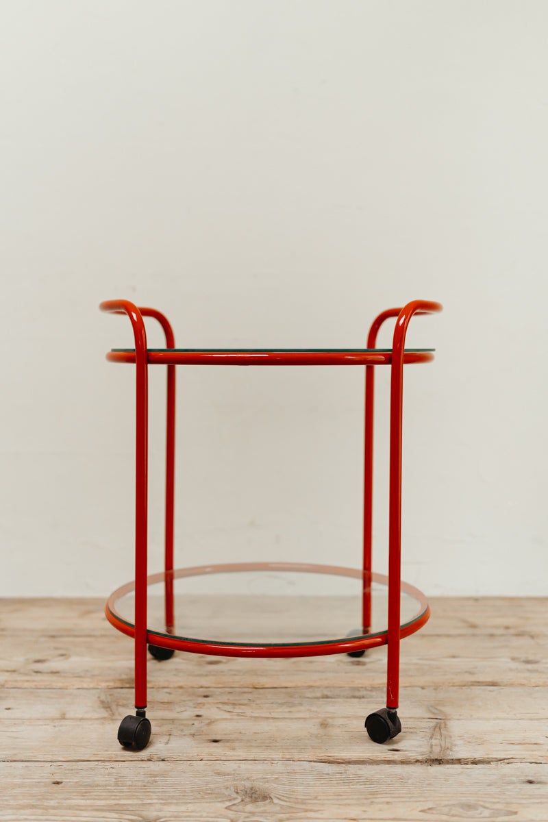 charming vibrant red aluminium and glass serving table, on its original wheels,
in very good vintage condition.