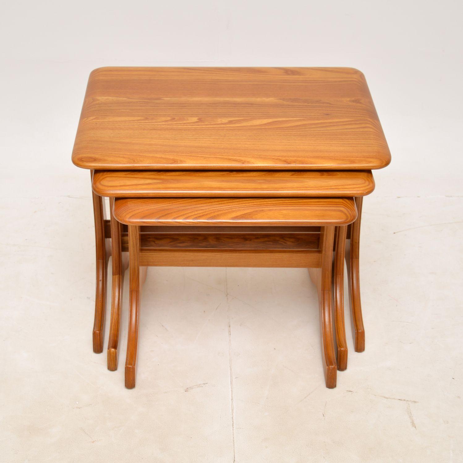 A beautifully constructed nest of three solid elm nesting tables. They were made in England, and they date from around the 1970s.
The quality is amazing, they are very well made from solid elm which has some gorgeous grain patterns. They are a