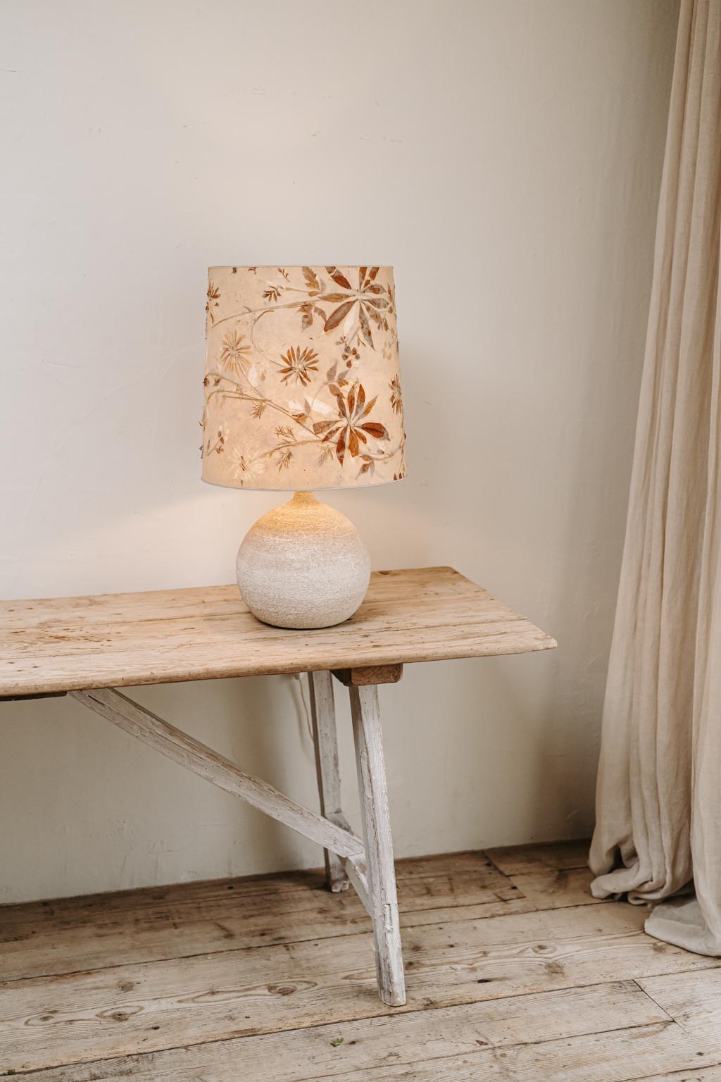 A lovely vintage stone lamp with its original lampshade.