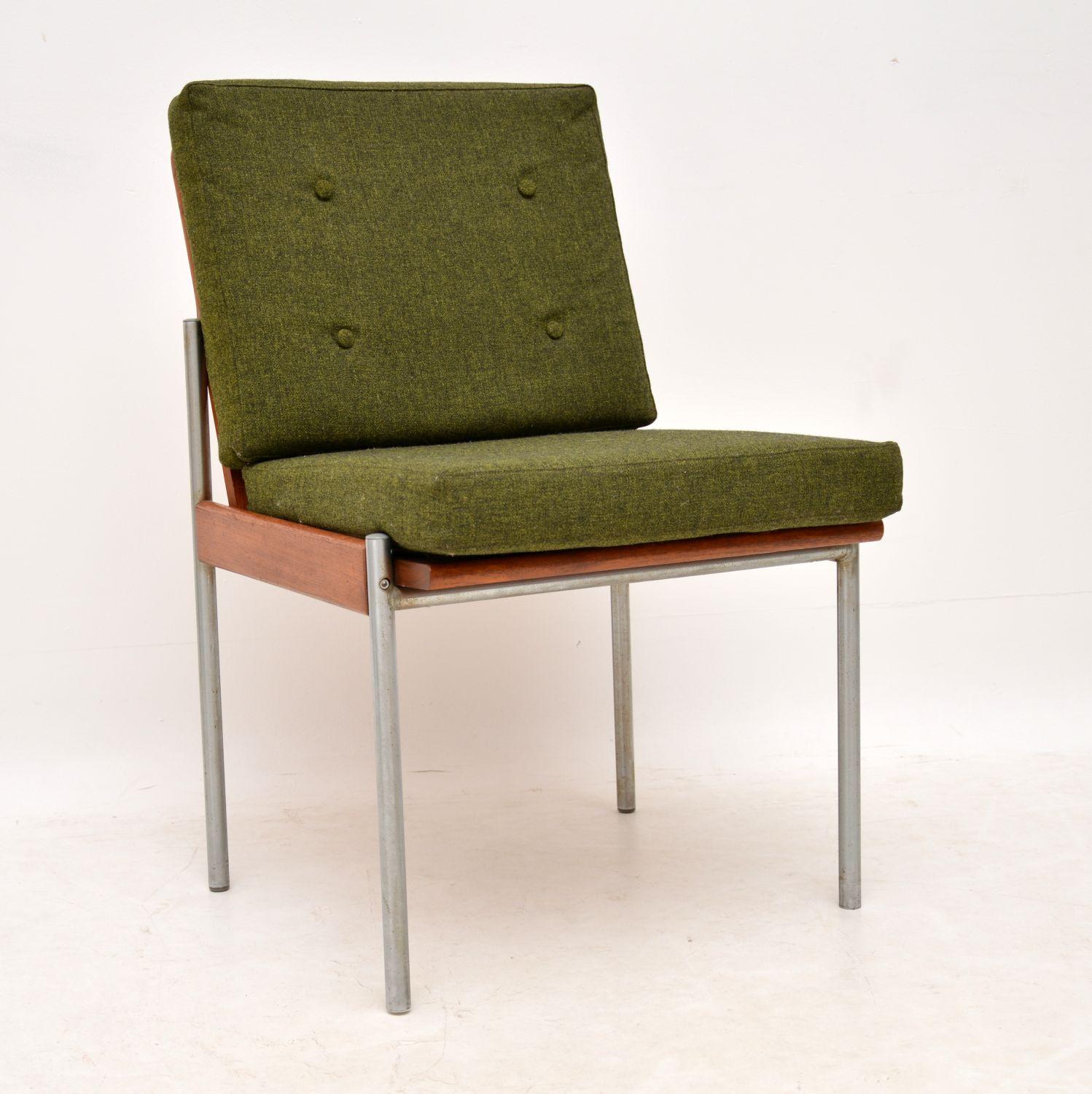 An unusual, stylish and very comfortable side chair, this dates from the 1970s. It has an aluminum and teak frame, with green loose cushions. The condition is excellent for its age, the frame is clean sturdy and sound. the green cushions are also