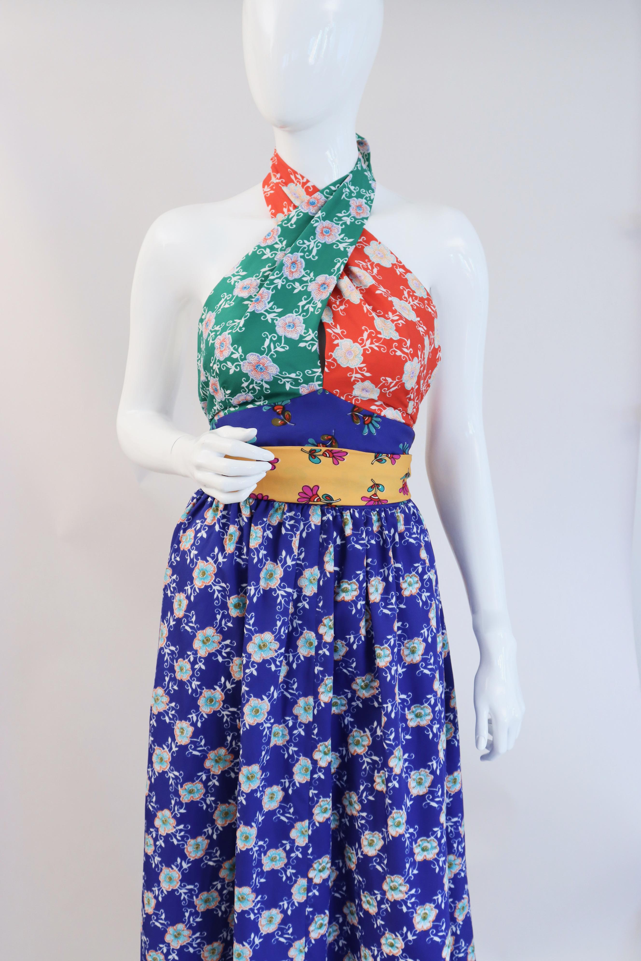 Vintage 70's Tri Color Floral Halter Dress!   I am obsessed with this dress, it is perfect in every way.  

 Designer: unknown has the Joseph Magnin Department Store Label

Size:  fits like an extra small-small

Length: 60 inches

Bust:
