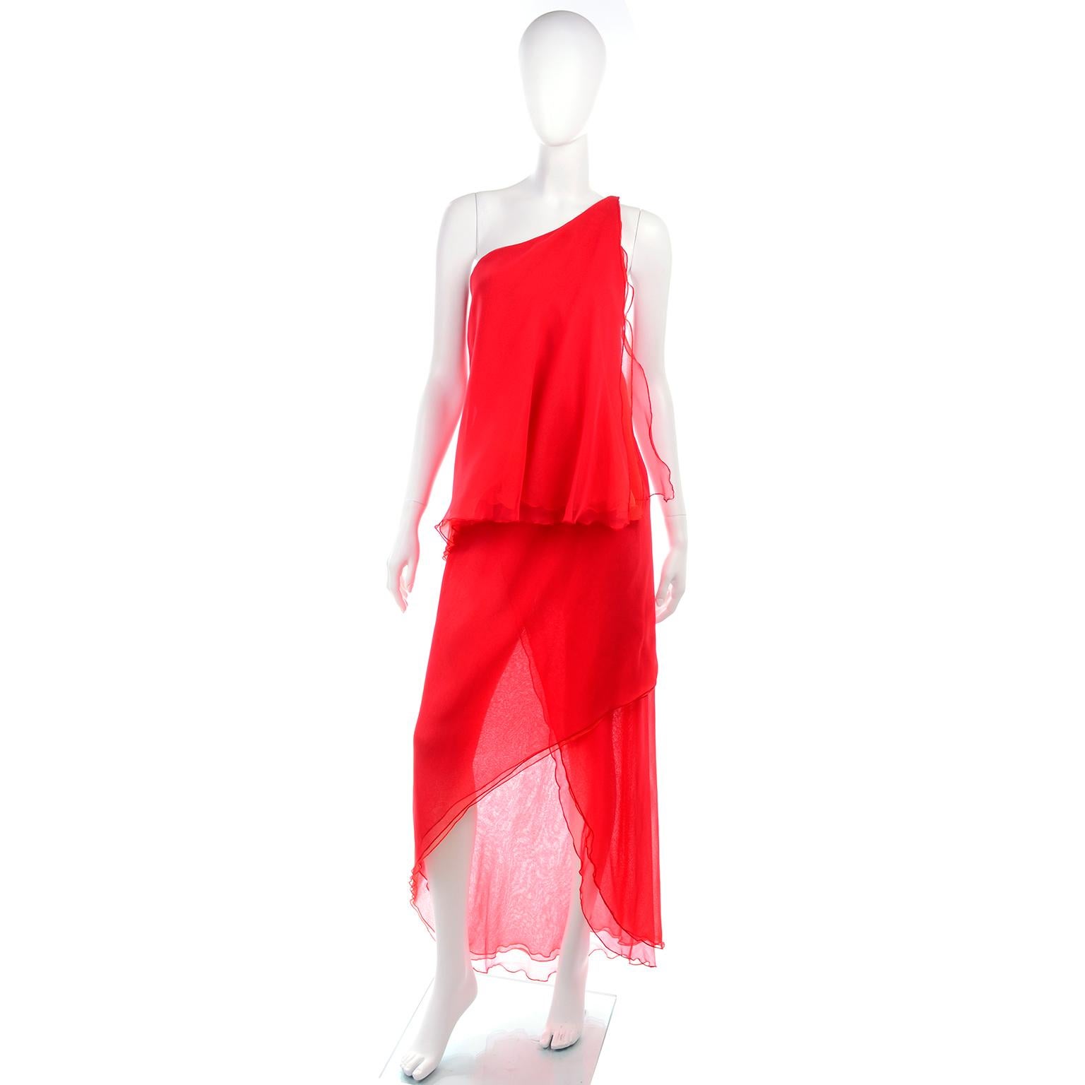 This is a really fun tomato red tiered vintage dress designed by Victor Costa in the 1970's.. The dress has one shoulder styling and the skirt is sheer. The body of this poly chiffon dress is one piece of fabric that wraps around body so the waist