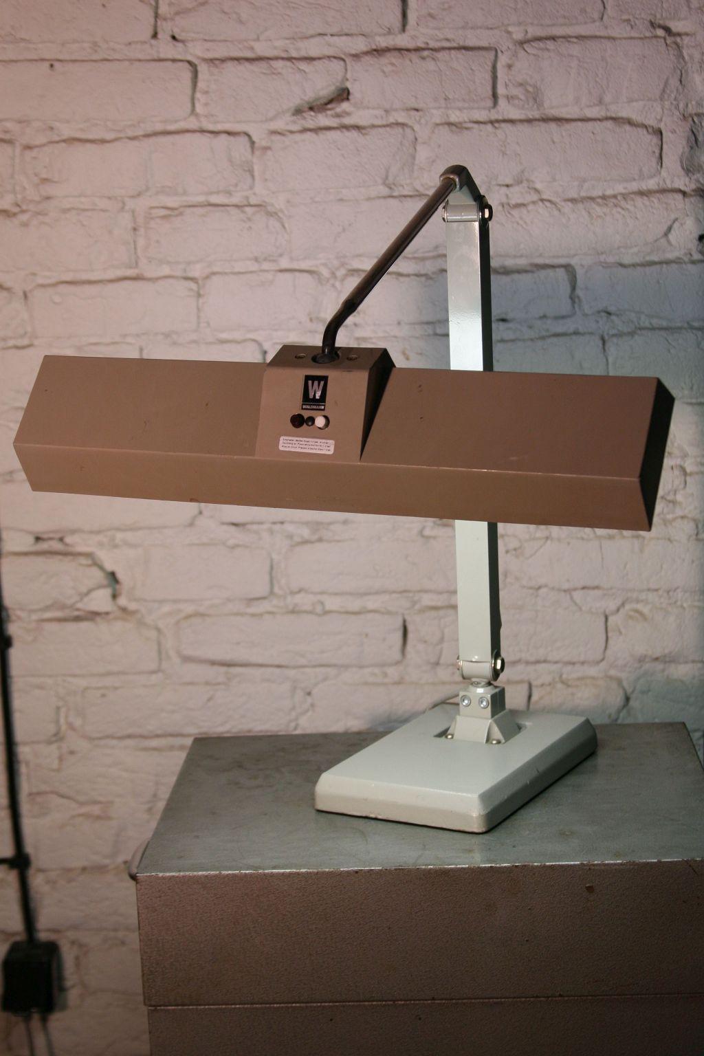 1970s Vintage Waldmann table lamp Model STK 215.
The original desk lamp produced in the 1970s by the German company Waldmann.
Construction;
Very heavy cast iron, stable base, two-part arm with fully adjustable lamp inclination, built-in plastic