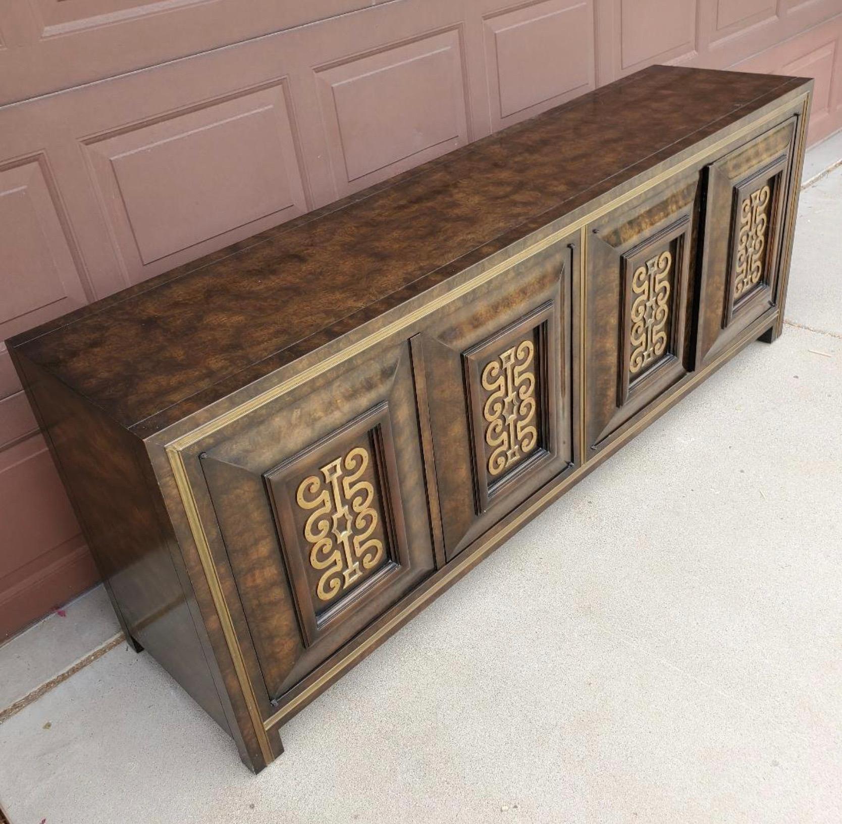 Spectacular Example of this Regency Burled Credenza/Buffet from famed Mastercraft. Impeccable Brass work inset into the four Burled doors like only Mastercraft can do. Beautiful William Deozema Design. Stunning piece.

Condition Disclosure:
Please
