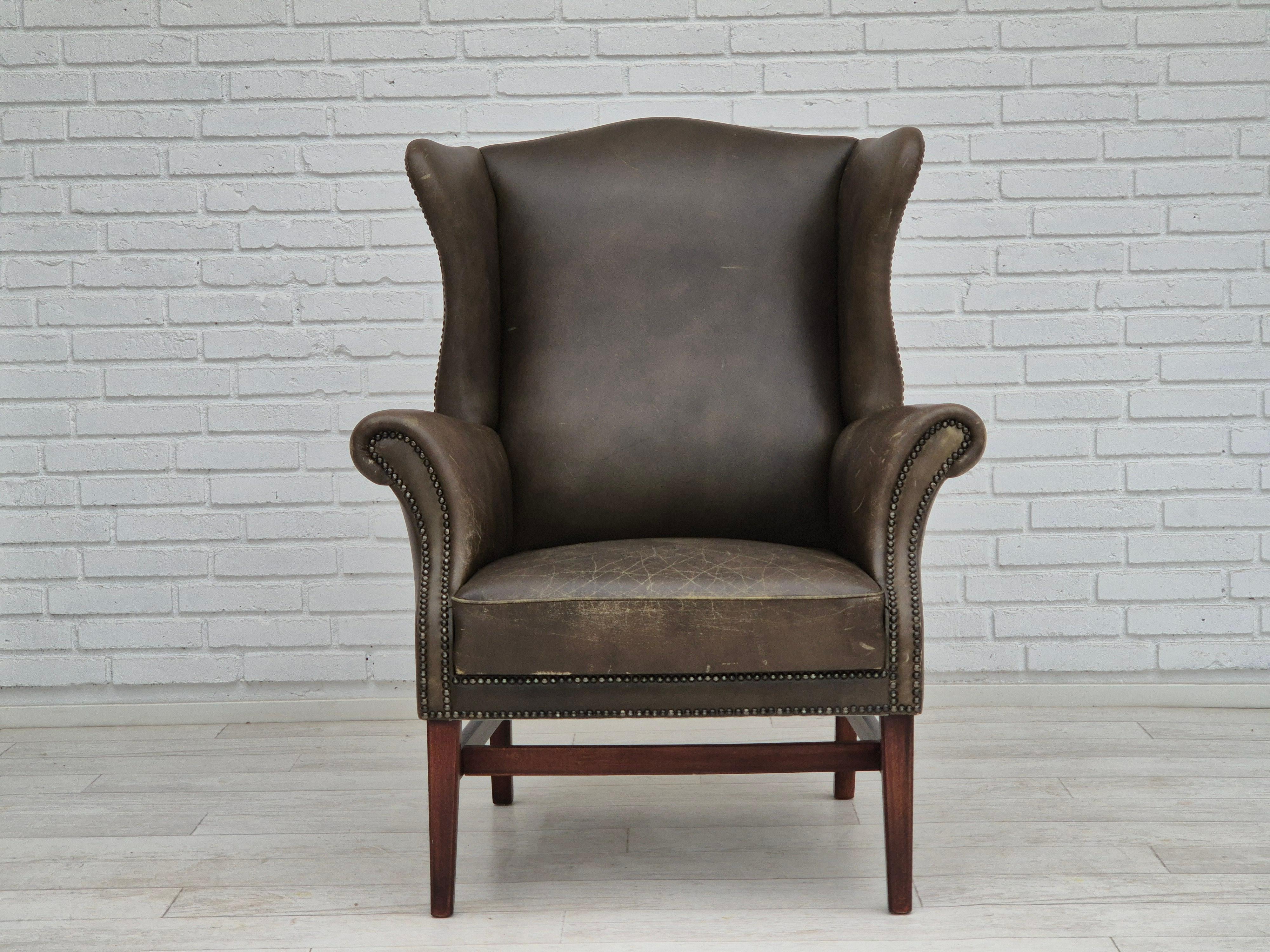 Scandinavian Modern 1970s, Vintage wingback armchair, original condition, leather, beech wood.