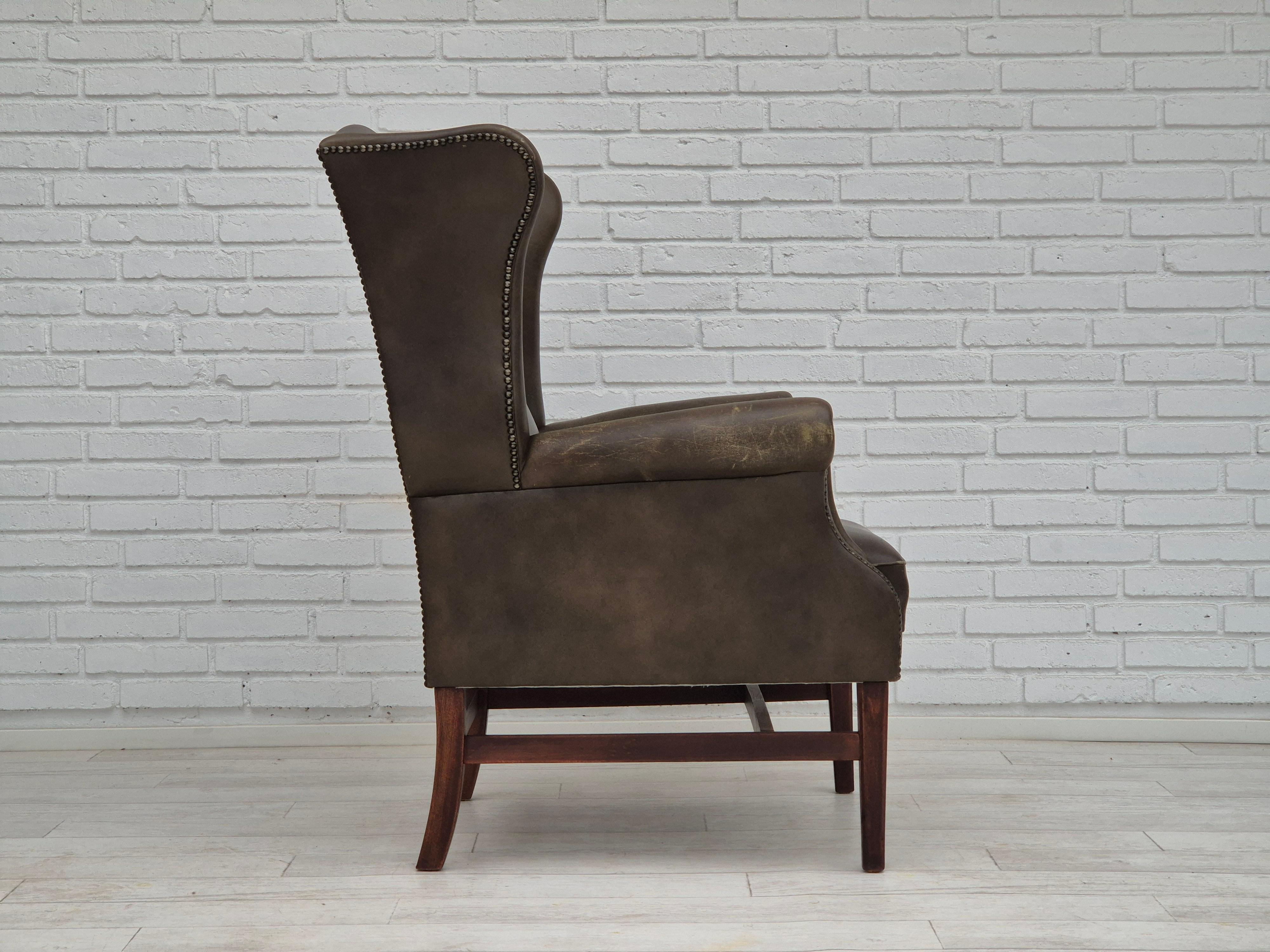 1970s, Vintage wingback armchair, original condition, leather, beech wood. In Good Condition In Tarm, 82