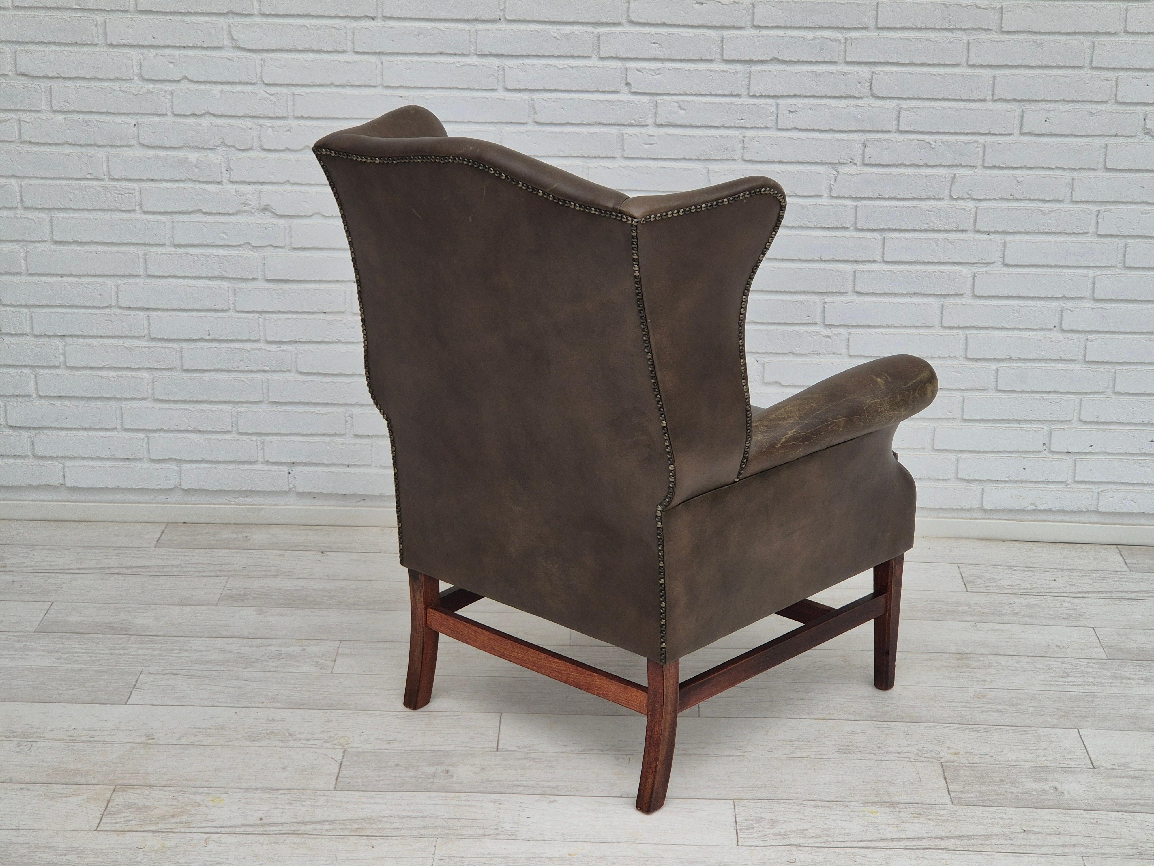 Late 20th Century 1970s, Vintage wingback armchair, original condition, leather, beech wood.