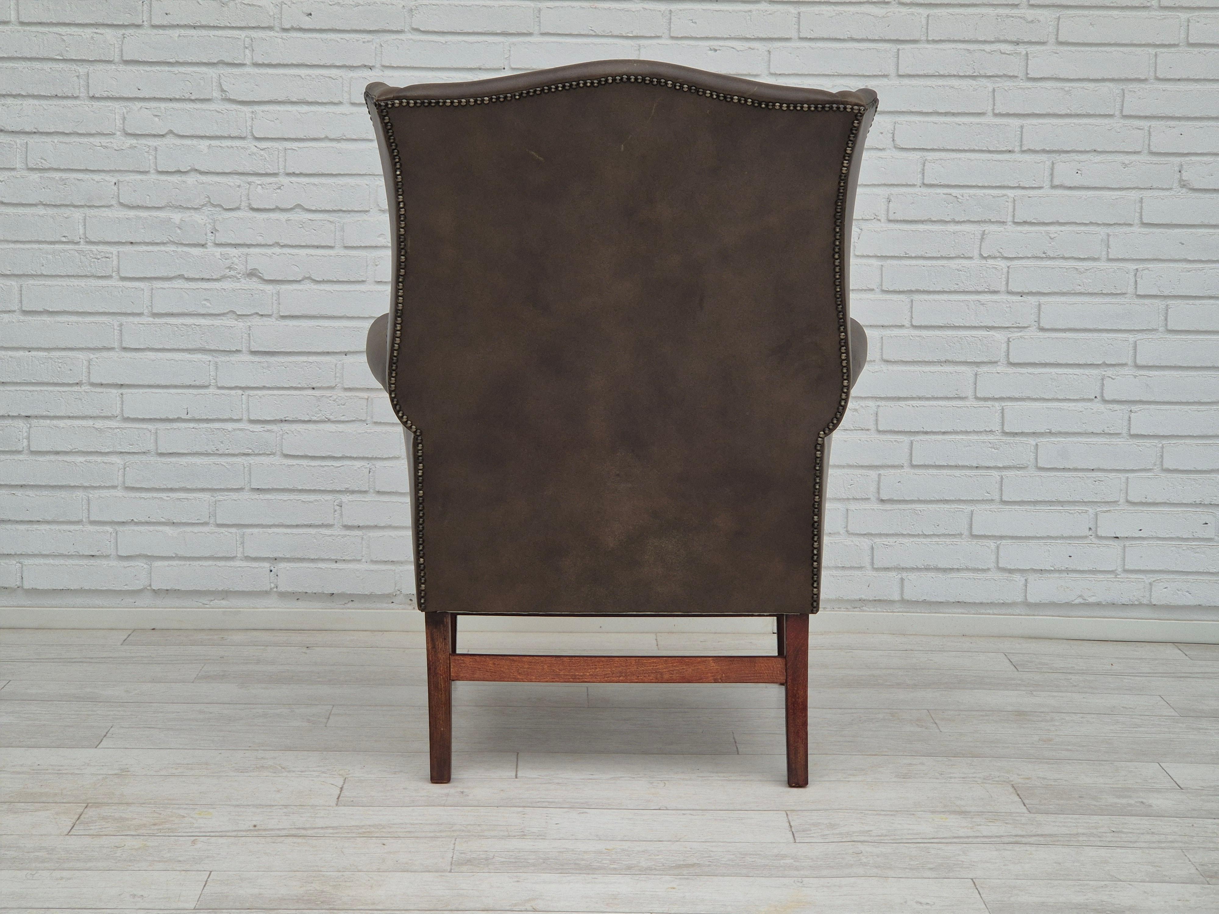 Leather 1970s, Vintage wingback armchair, original condition, leather, beech wood.