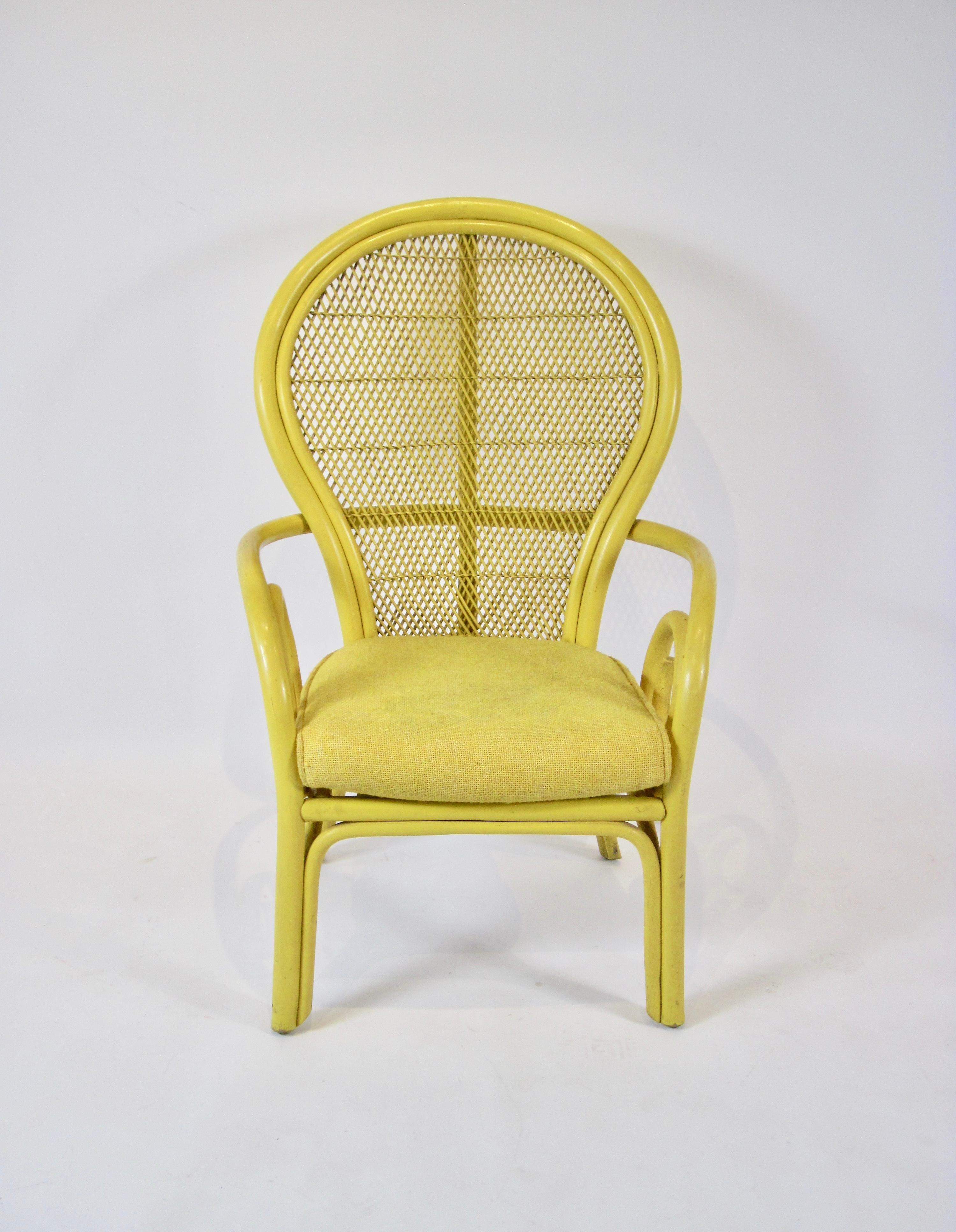 Bohemian style 1970s vintage yellow rattan balloon chair with lattice back, scroll arms and zippered cushion in happy yellow. Original patina.