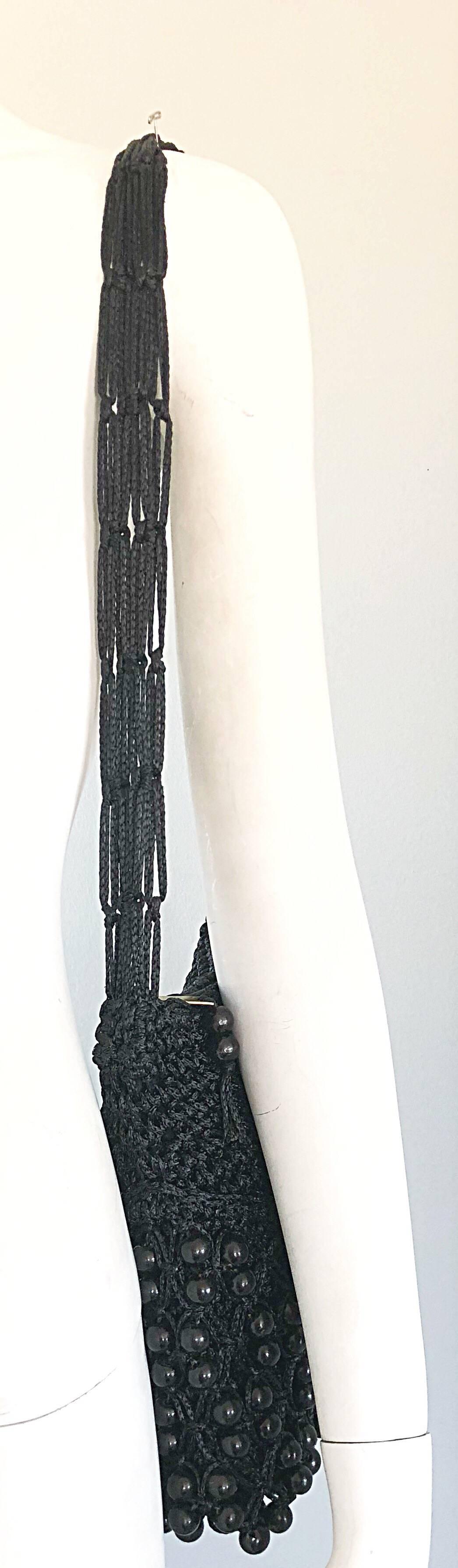Fantastic vintage WALBORG black crochet knit beaded shoulder bag! Features a multi-strand shoulder strap that fits comfortably on the shoulder. Uniquely, this bag features the same black lacquer beading on both the front and back of the purse. The
