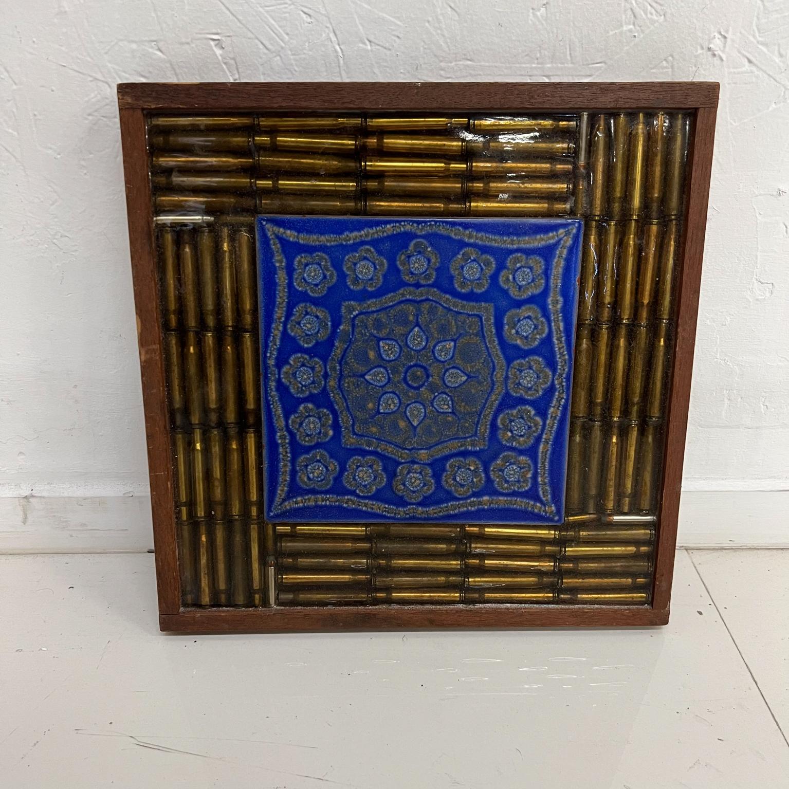 1970s Wall Art Wood Framed Bullet Mosaic with decorative blue tile 
13.5 x 13.75 x 1.25 thick
Preowned vintage unrestored condition.
See images provided.
 
