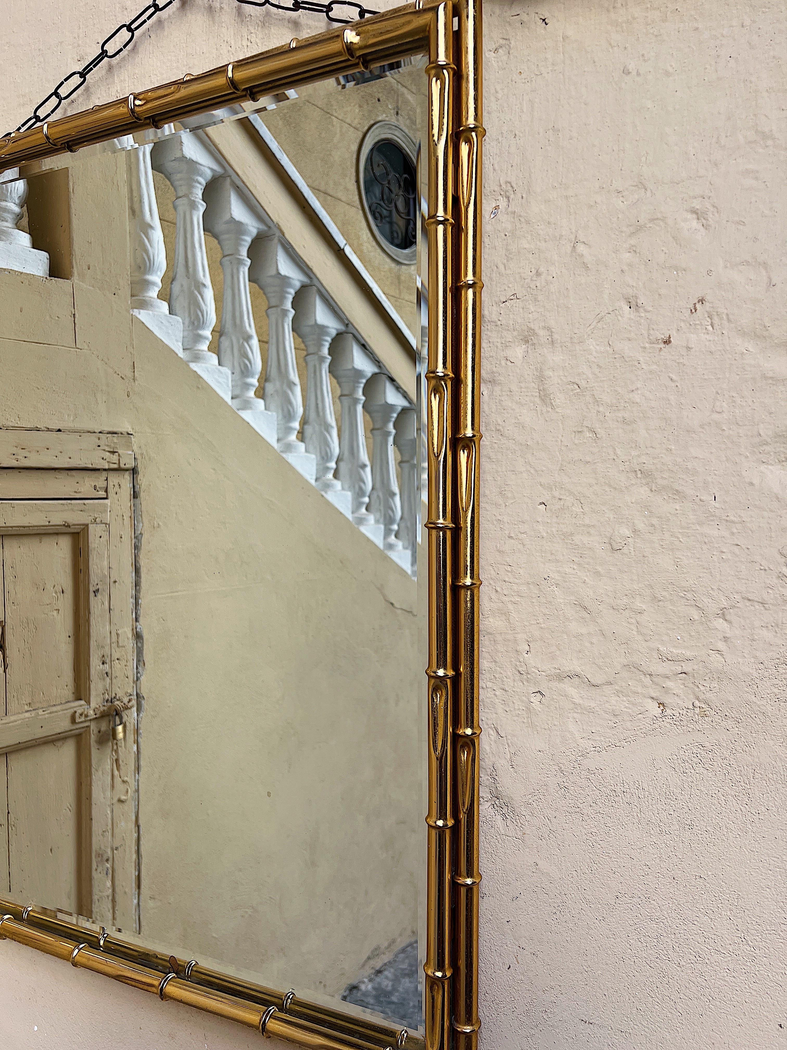 1970s wall mirror with a bamboo-effect gilded metal frame.  For Sale 3
