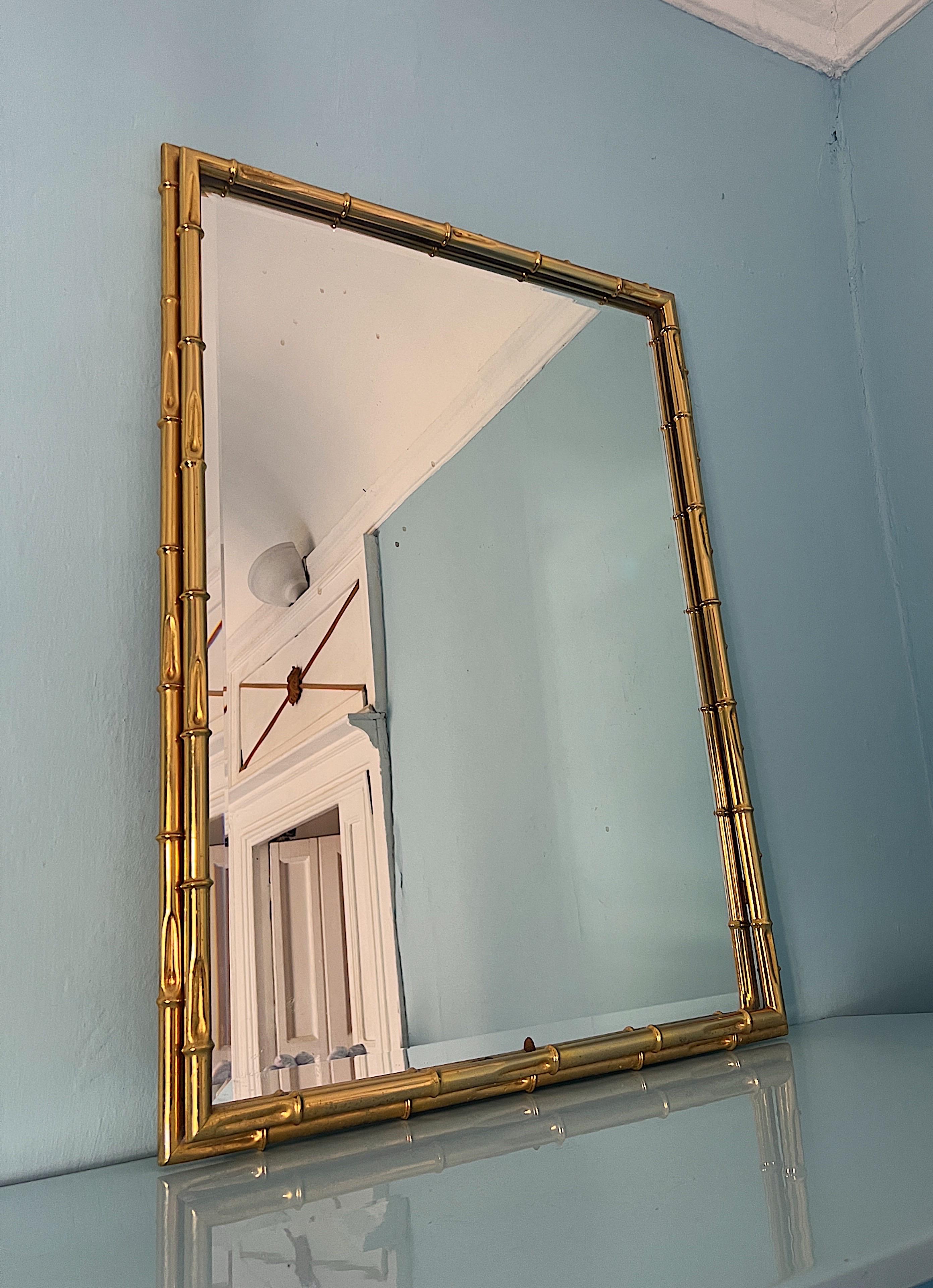20th Century 1970s wall mirror with a bamboo-effect gilded metal frame.  For Sale