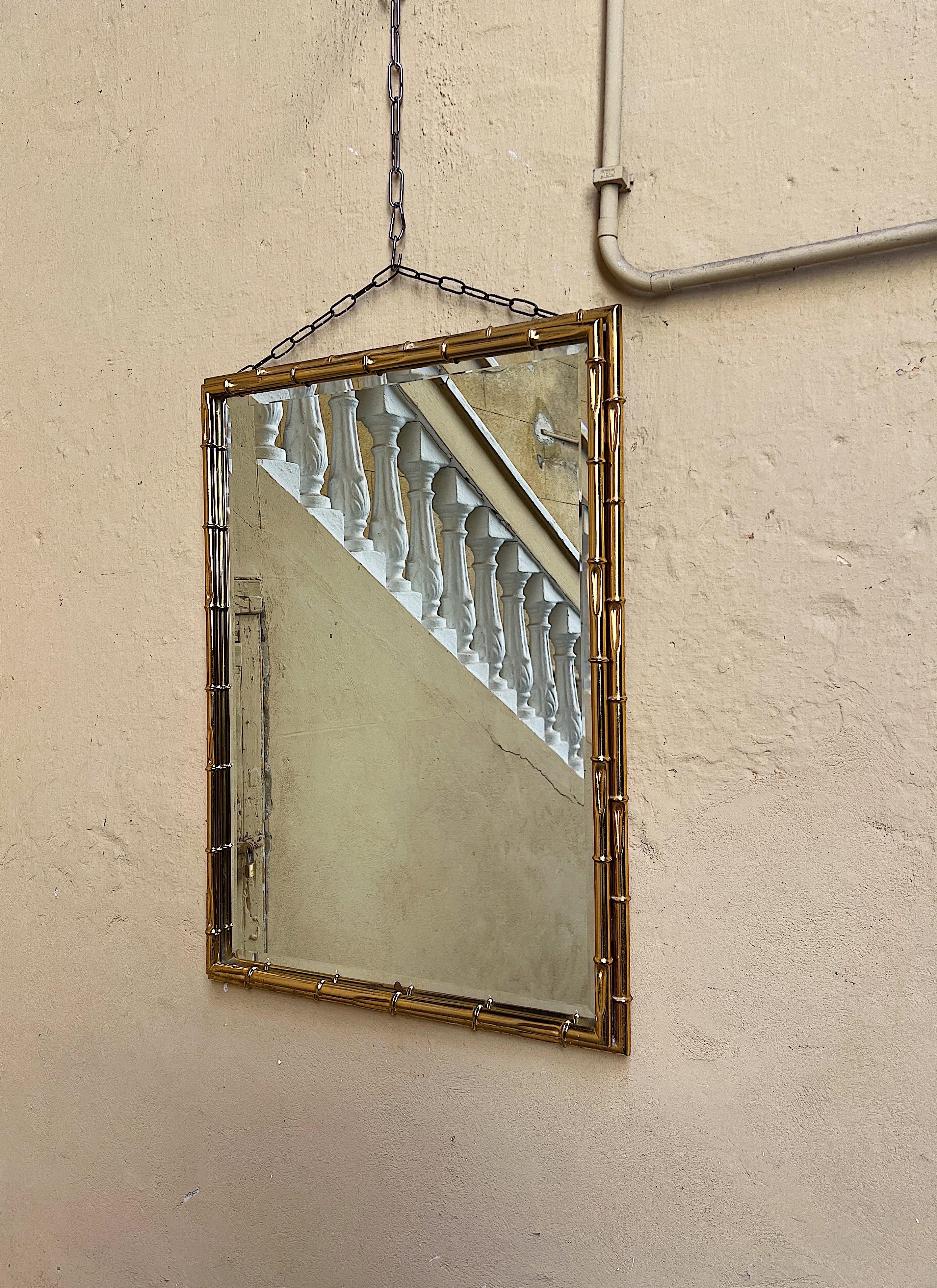 1970s wall mirror with a bamboo-effect gilded metal frame.  For Sale 1