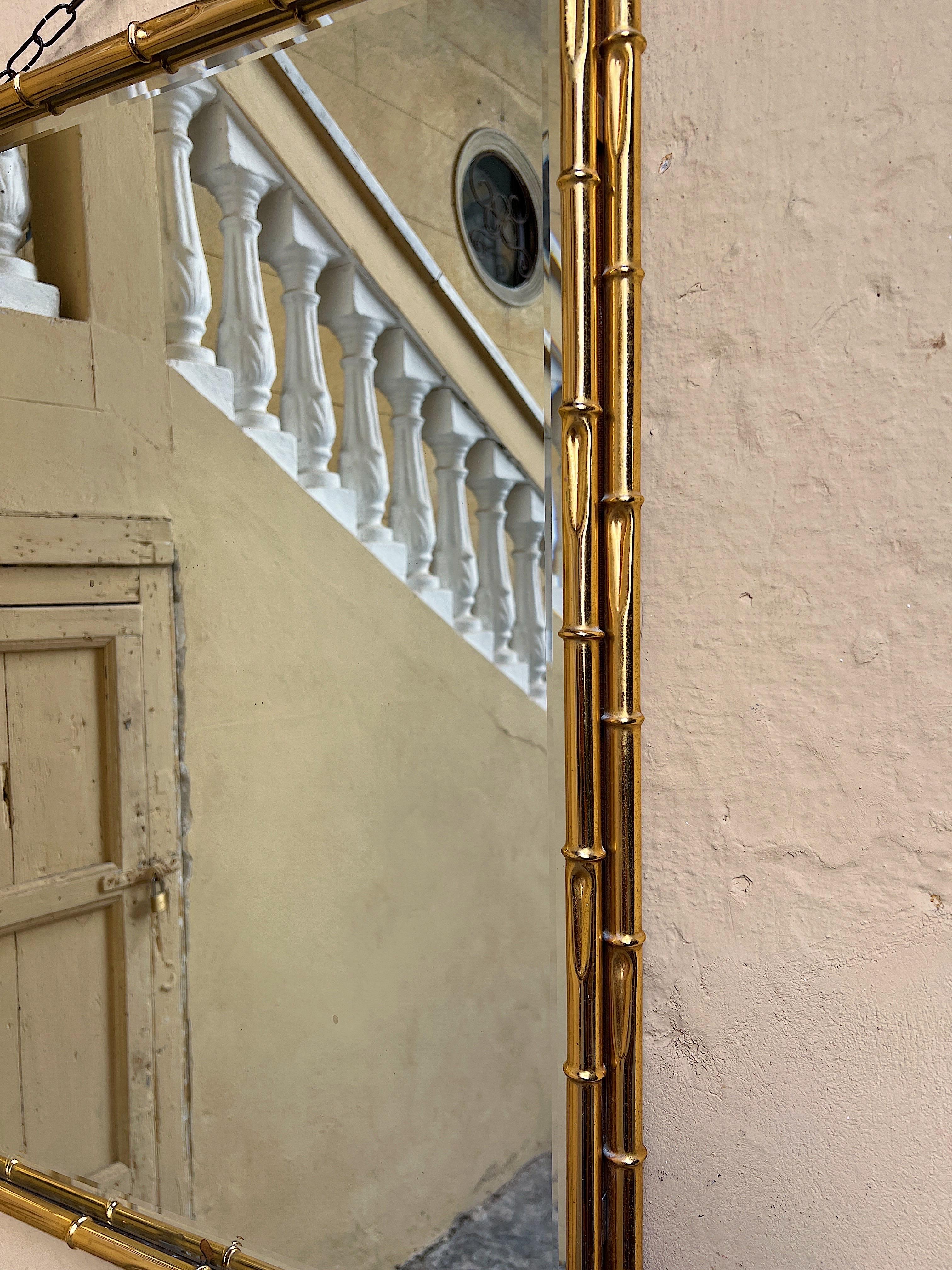 1970s wall mirror with a bamboo-effect gilded metal frame.  For Sale 2