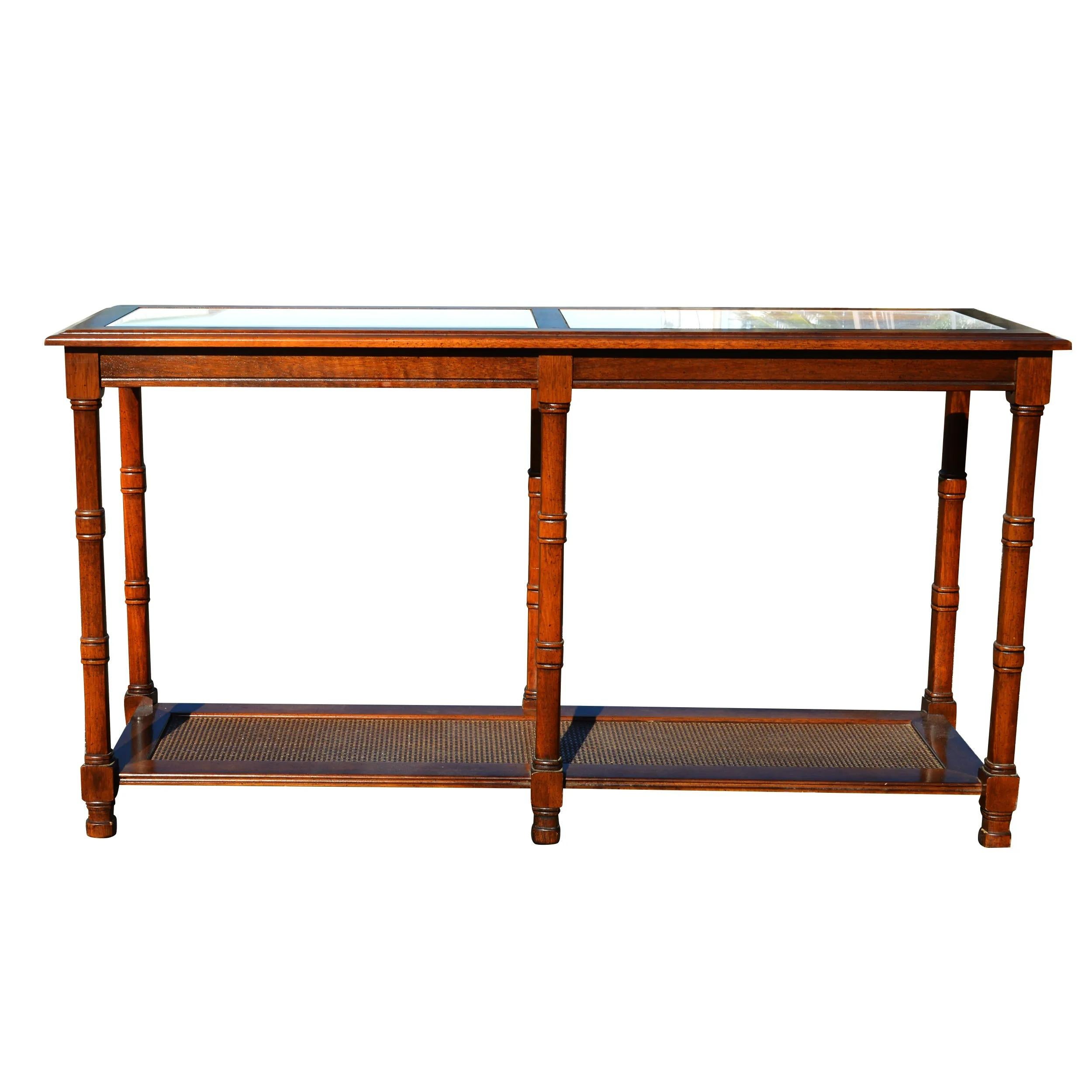 1970s Walnut two tier glass top console table cane shelf.

Two removable beveled glass inserts with a cane shelf.
 
Table measures 52 