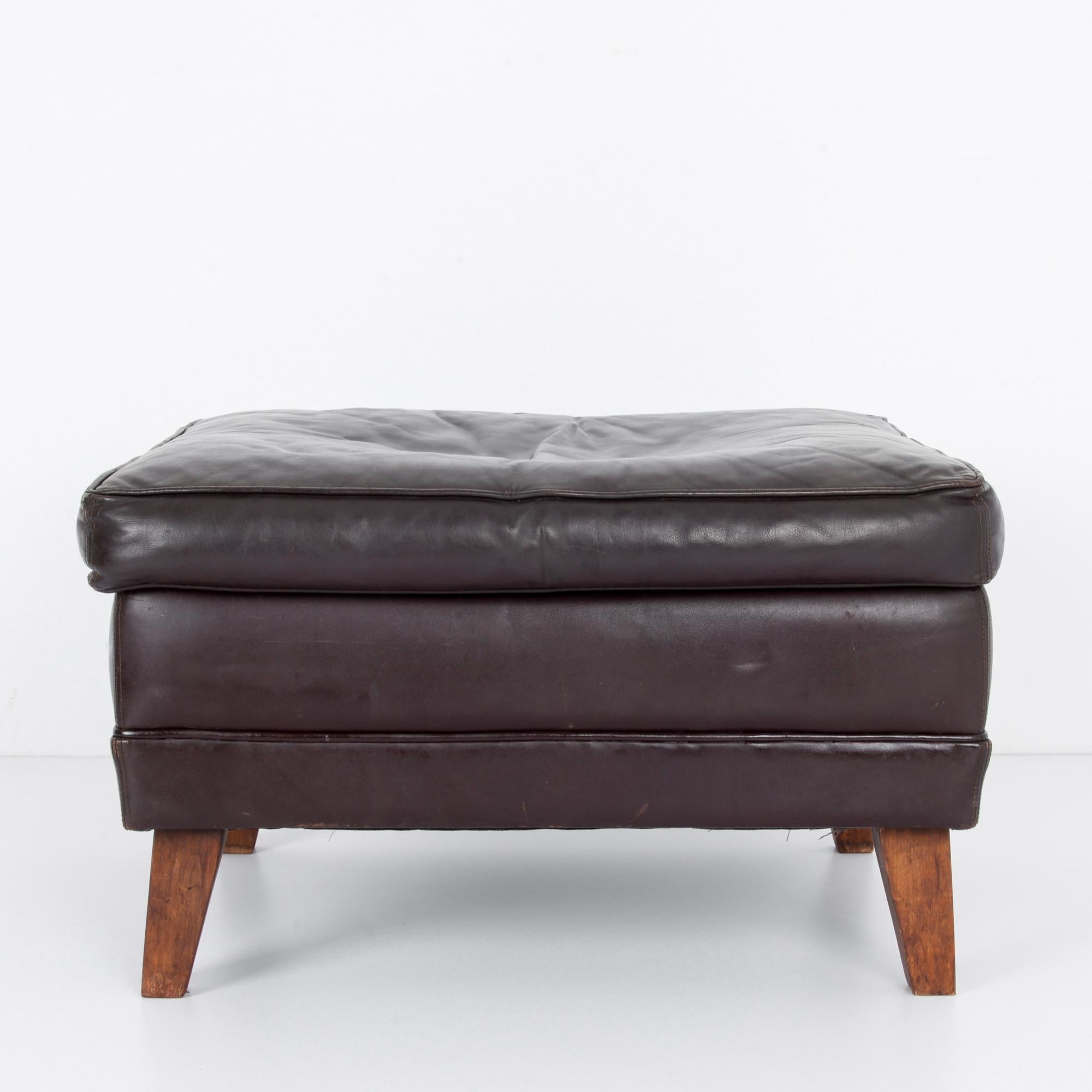 This ottoman was made by Walter Knoll in Germany, circa 1970. Since its establishment in the 19th century, “Knoll leather” has been synonymous with quality, and the luxurious leather of this ottoman is exemplary of the Knoll heritage. With a