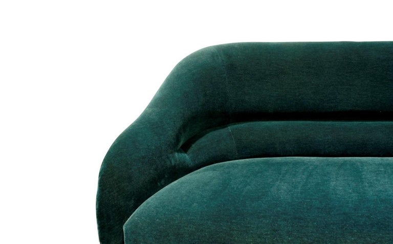 Clean lined sofa, designed by Ward Bennett for Brickel Associates sofa model no. 2092 with back pleat Professionally upholstered in a green velvet with dark stained legs, circa 1970s. The sofa has wonderful proportions and look amazing from every