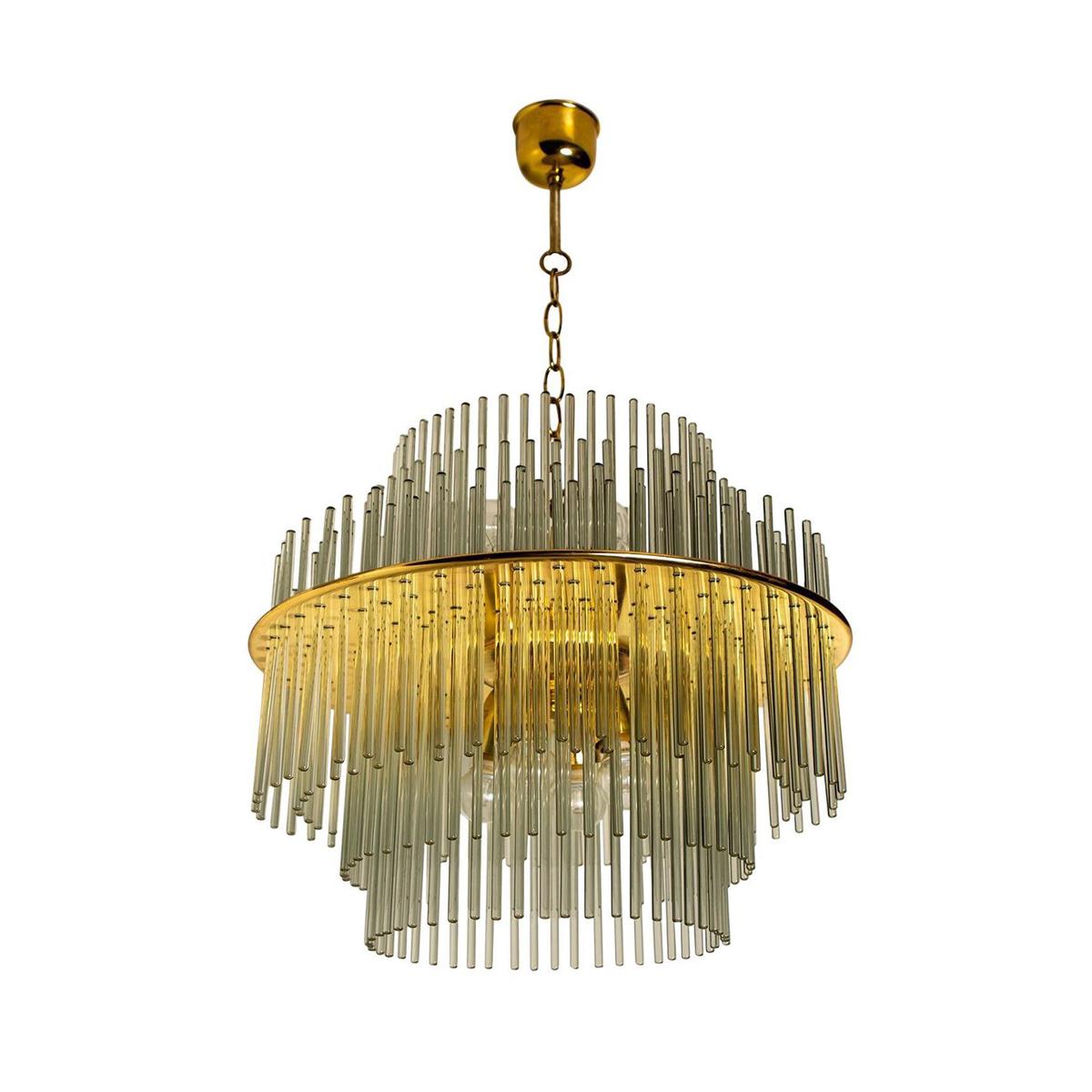 Designed by the renowned Italian designer Gaetano Sciolari and manufactured in the USA by Lightolier, this stunning chandelier epitomises the bold and opulent style of its time and of vintage elegance, a true testament to the enduring allure of