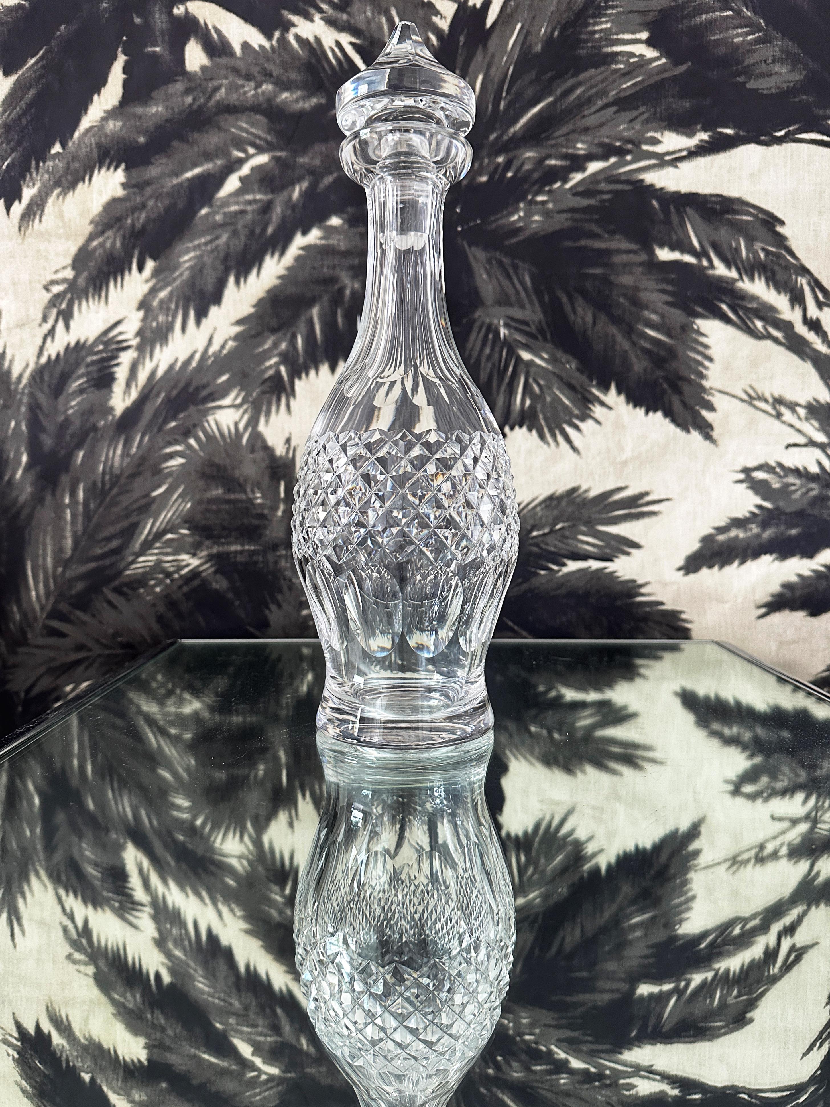 Vintage waterford crystal decanter with elegant Moorish inspired design, features a stylized genie bottle with pointed stopper. Handcrafted and mouth-blown lead crystal with brilliant prismatic diamond cuts and etched designs throughout. The