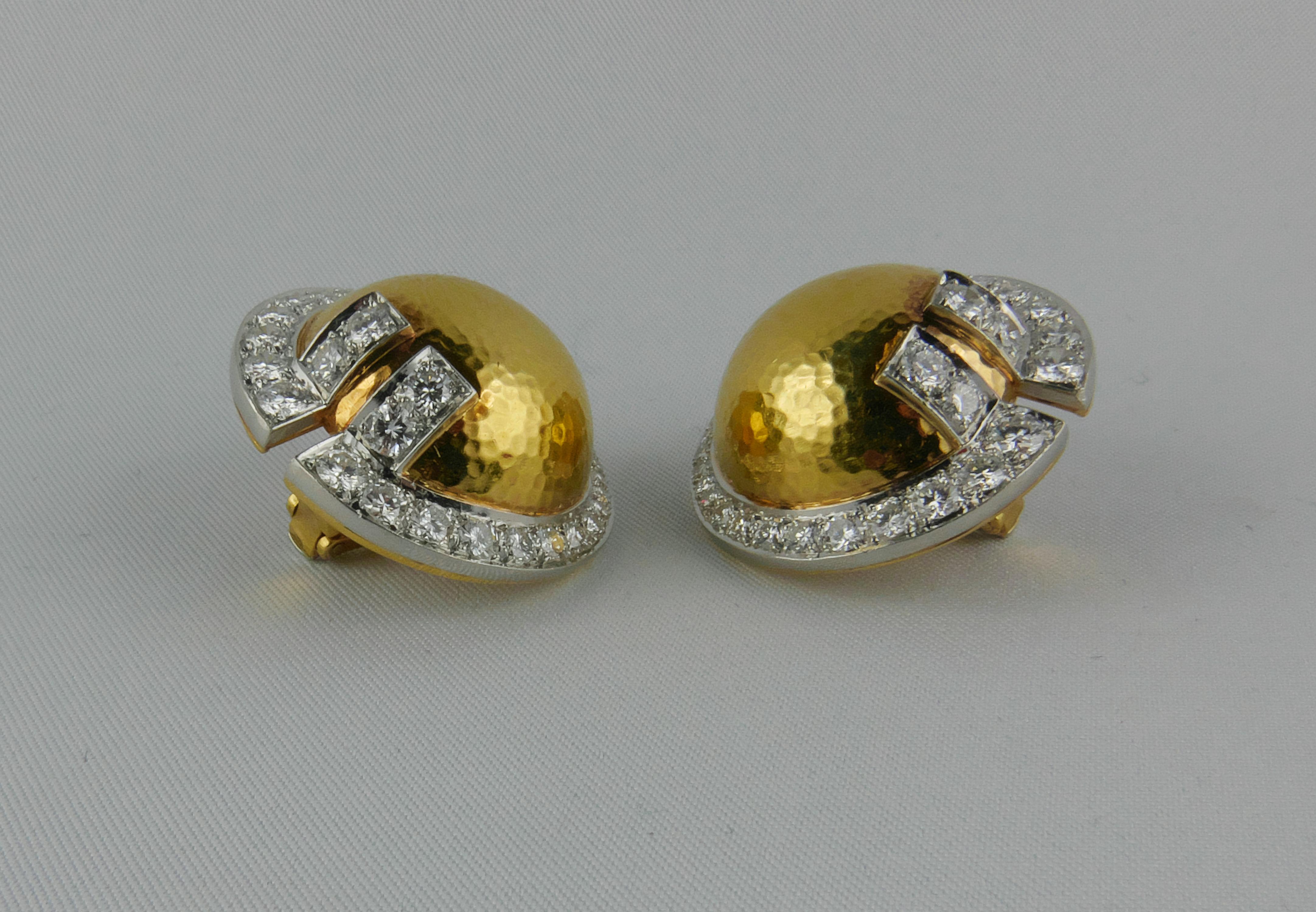 Extremely elegant and imposing 1970s David Webb finely crafted in rich 18 karat Yellow Gold geometric Earrrings framed in glittering Diamonds   

This striking highly sculptural pair of clip-on Earrings is formed by a round domed top in polished