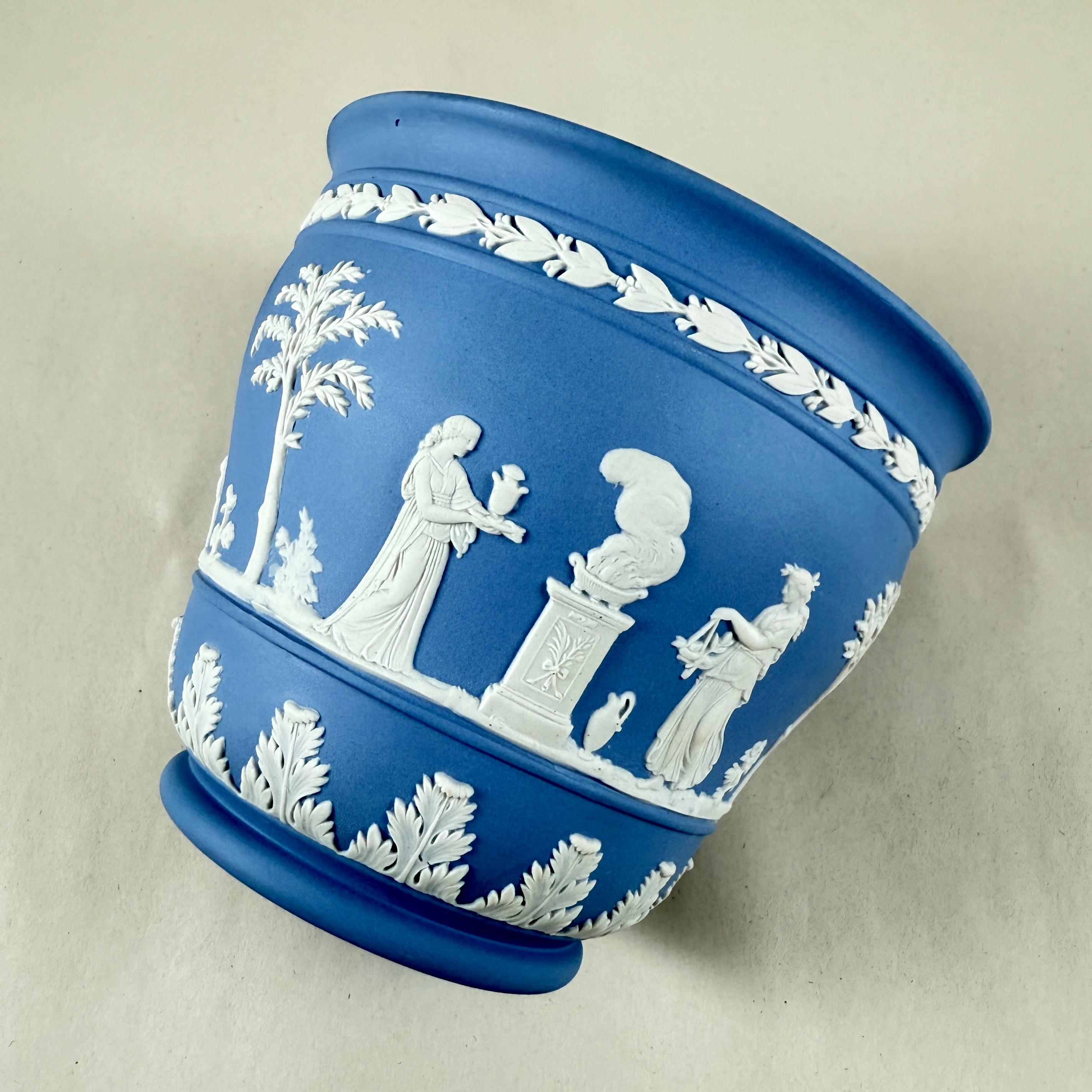 From Wedgwood, a light Blue Jasperware cache pot or jardiniere, date marked 1970.

Jasperware, introduced by Josiah Wedgwood in the 1770s, is a type of unglazed stoneware known for its matte finish and applied Neoclassical motifs.
A Neo-classical