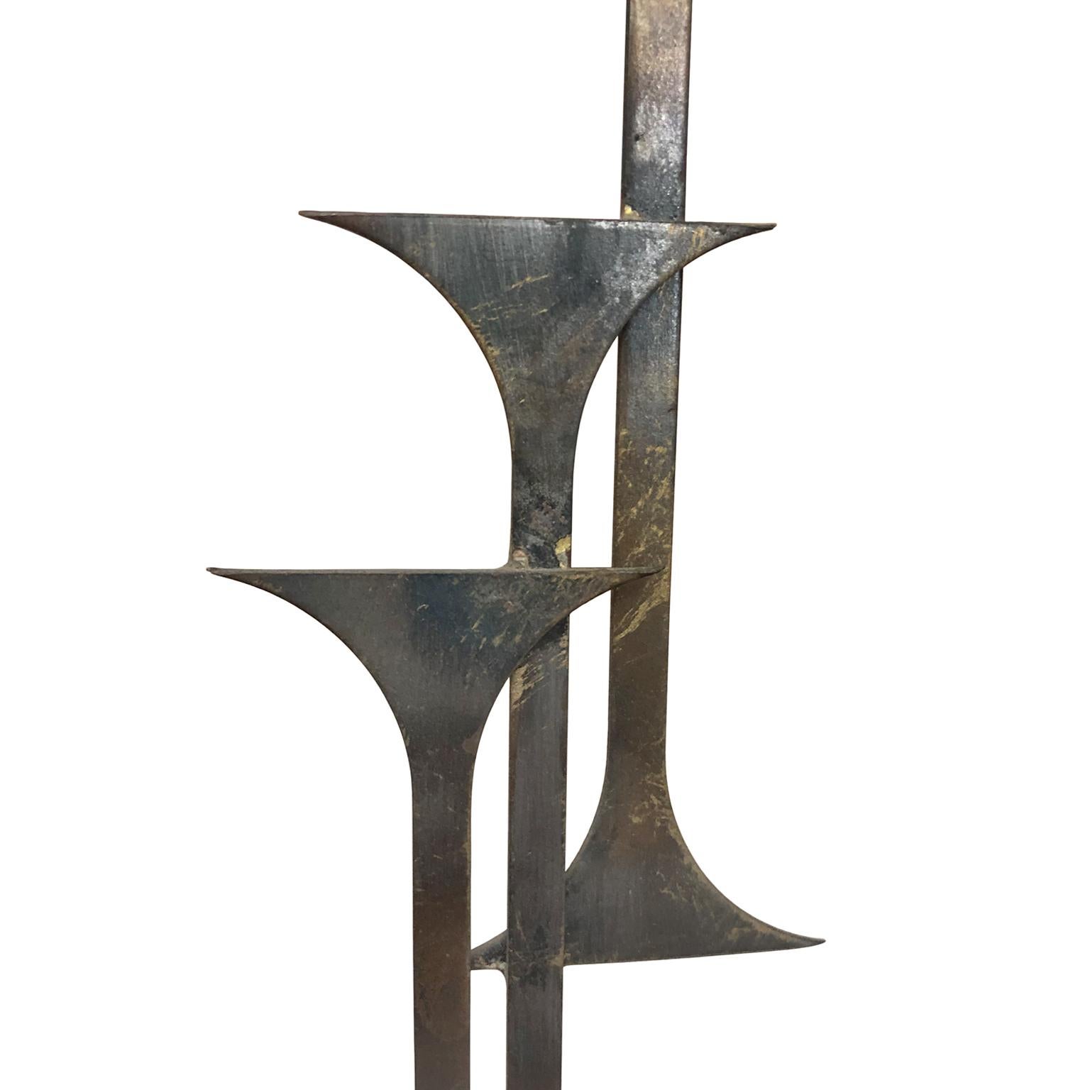 Welded metal rising tower sculpture, signed 