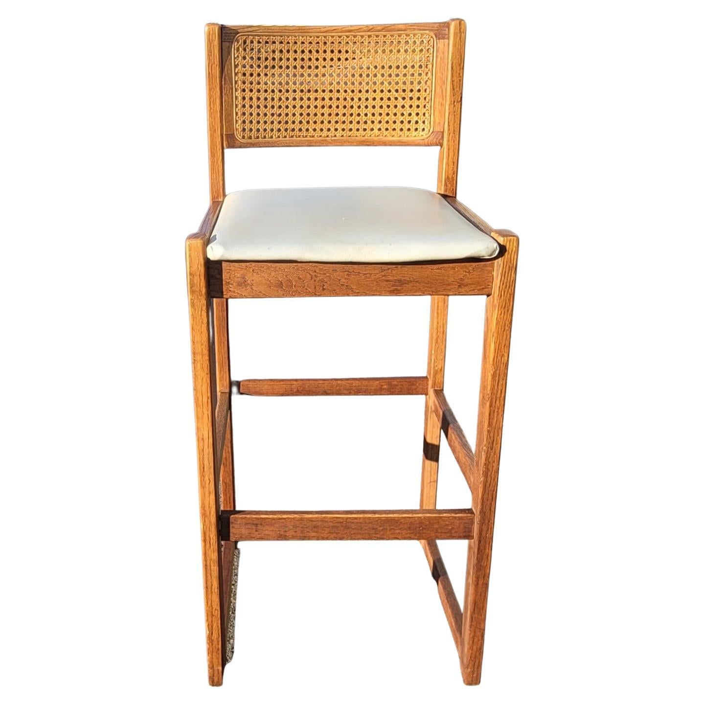 American 1970s Whitaker Furniture Oak with Cane Back and Leatherette Seat Bar Stools For Sale