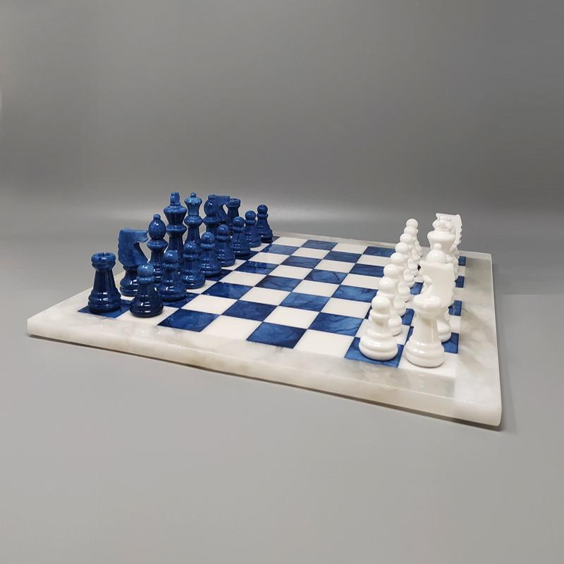 1970s Elegant white and blue chess set in Volterra alabaster handmade. Made in Italy, the items are in excellent condition.
This chess set is gorgeous. So rare to find in these colors
Dimensions:
14,56